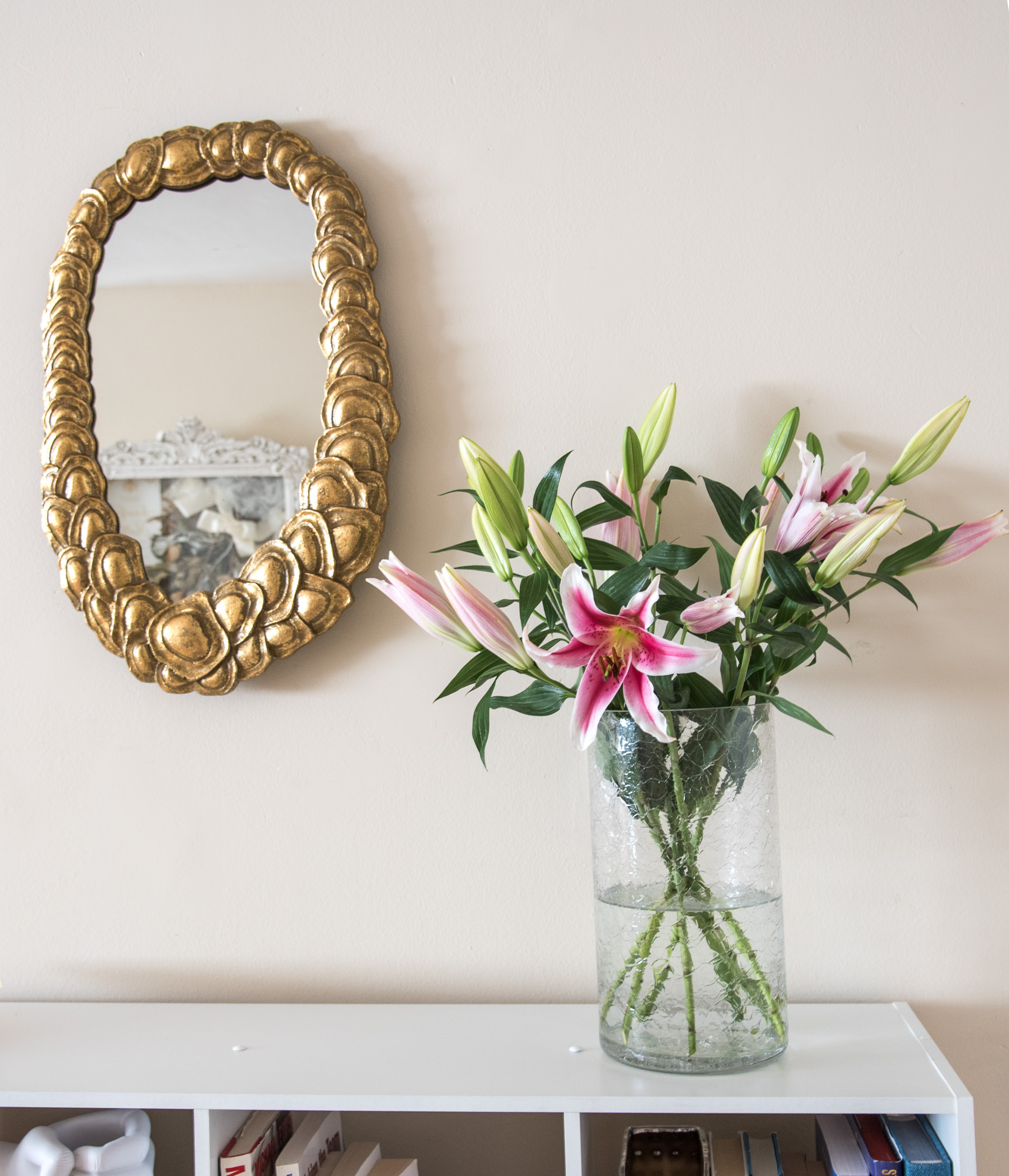 gold garland mirror in the foyer