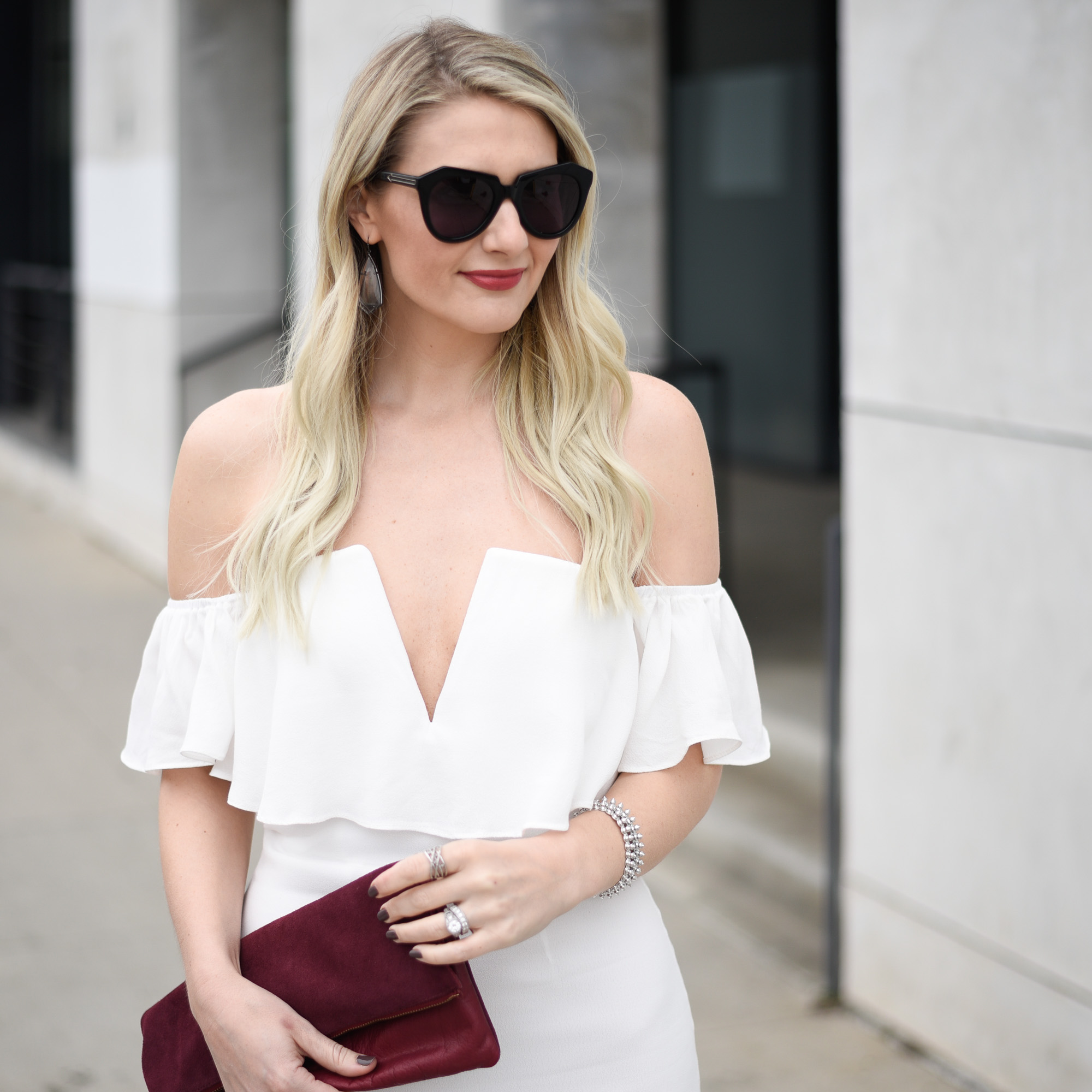 oversized black sunglasses and the best red lipstick color 