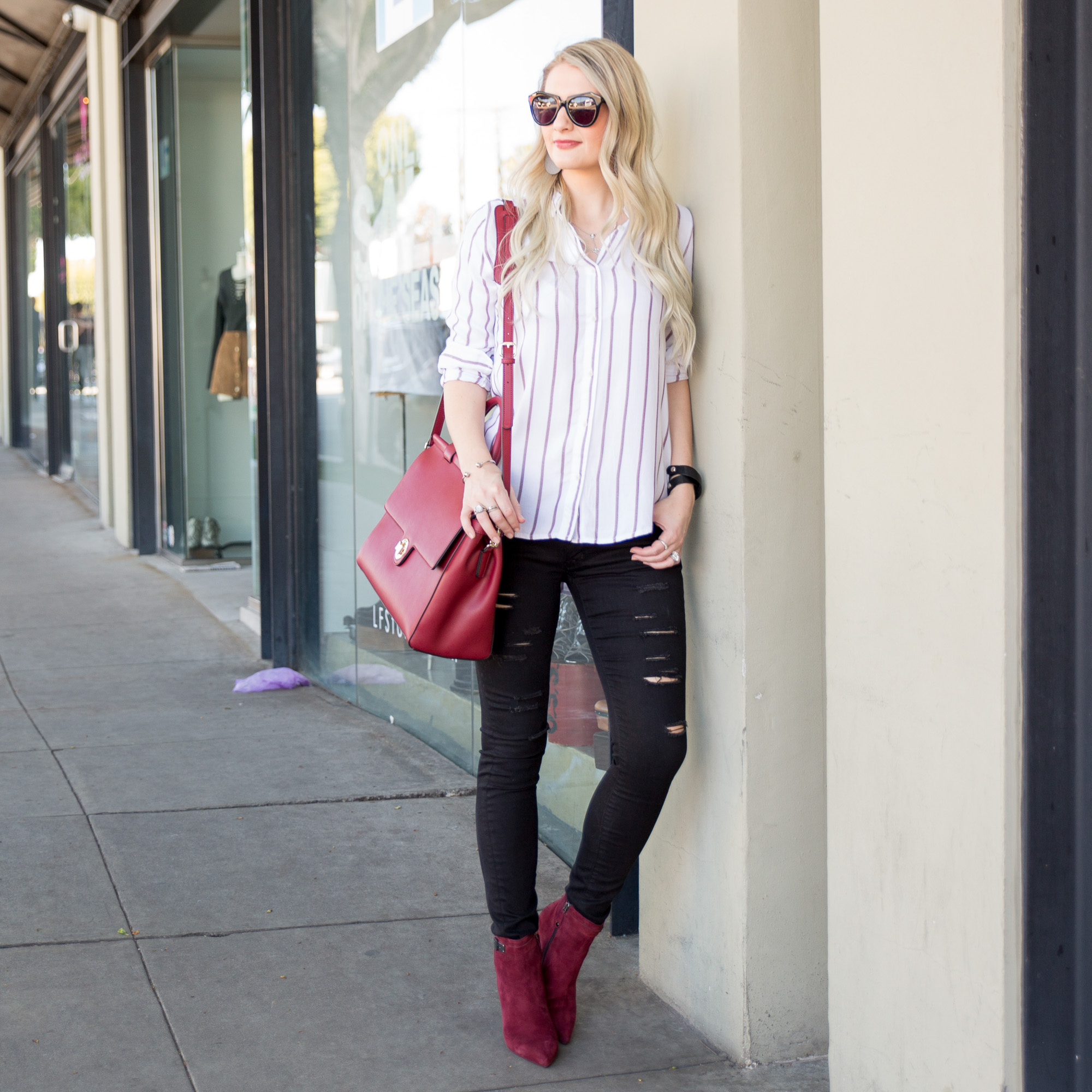 black ripped skinnies and burgundy suede booties 