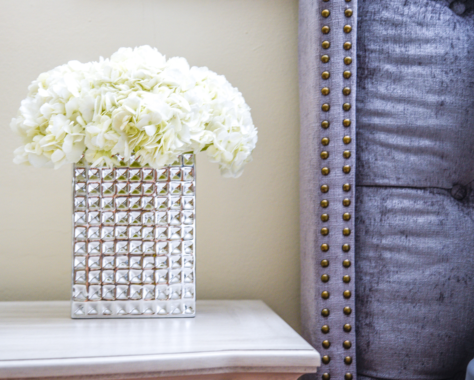 hydrangeas in a block silver vase for your bedside table 