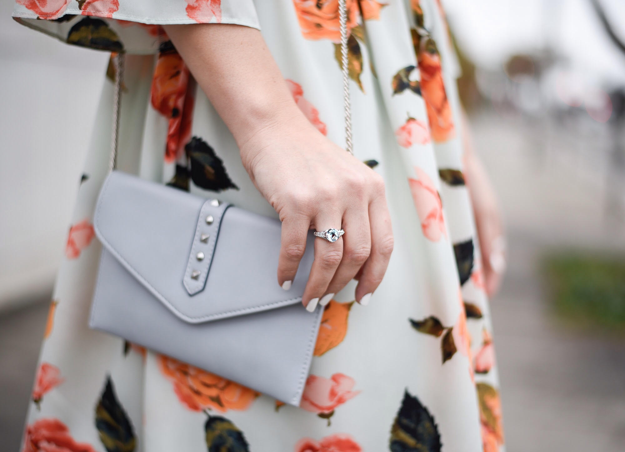 Jenna Colgrove wearing a light blue custom ring by Diamondere. 