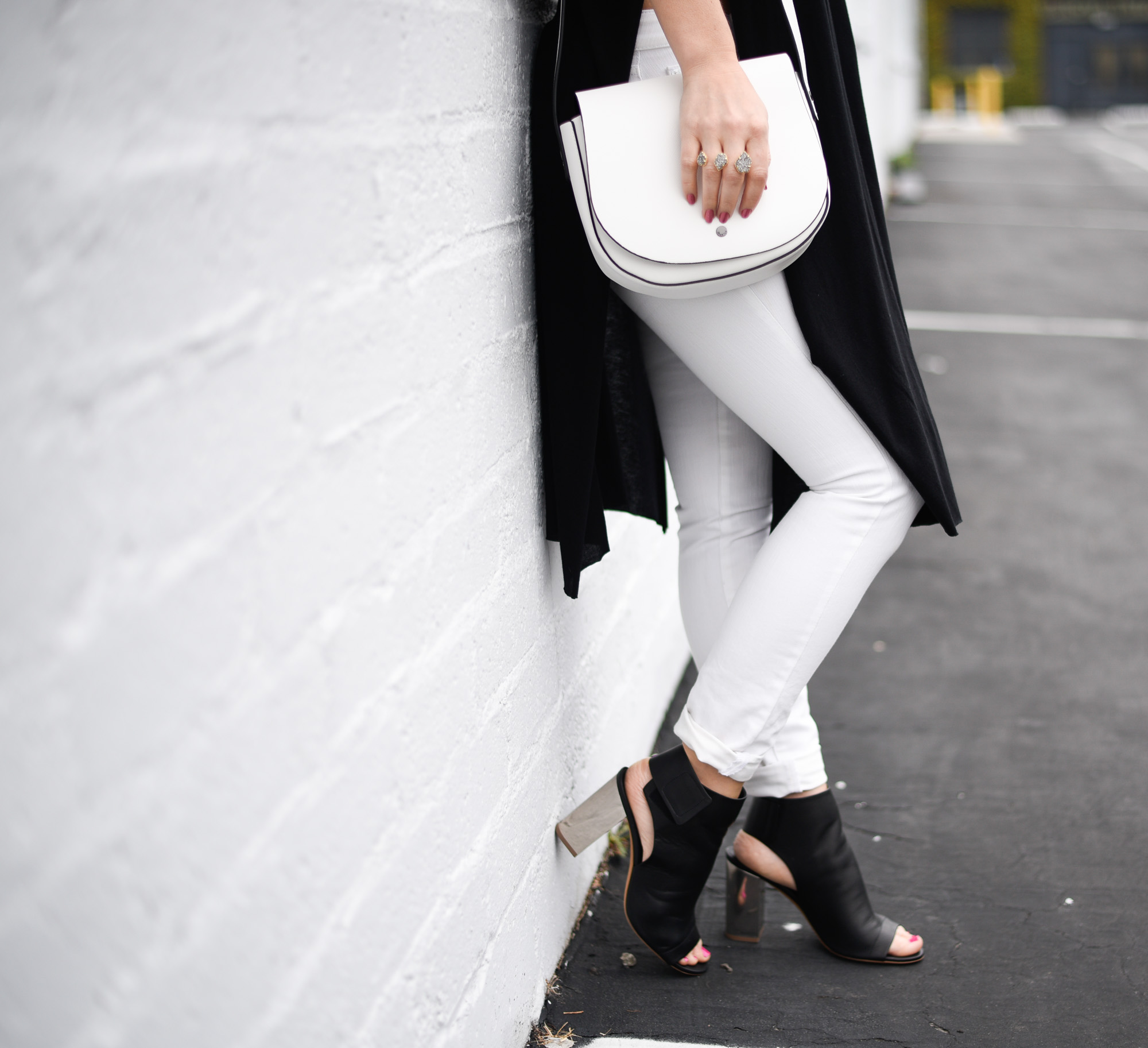 Black booties with a metallic heel