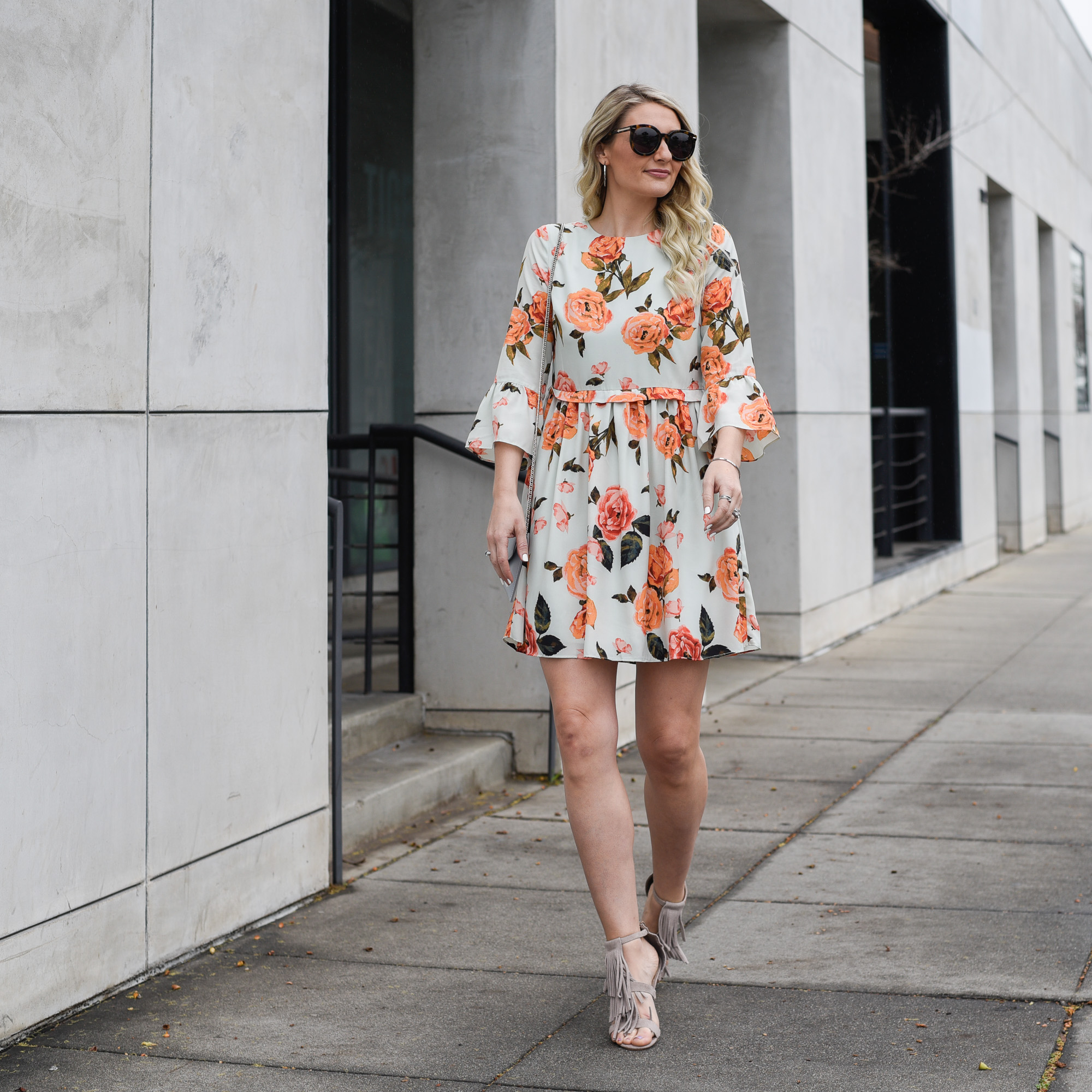 Jenna Colgrove wearing a floral fit and flare dress with a beautiful flow. 