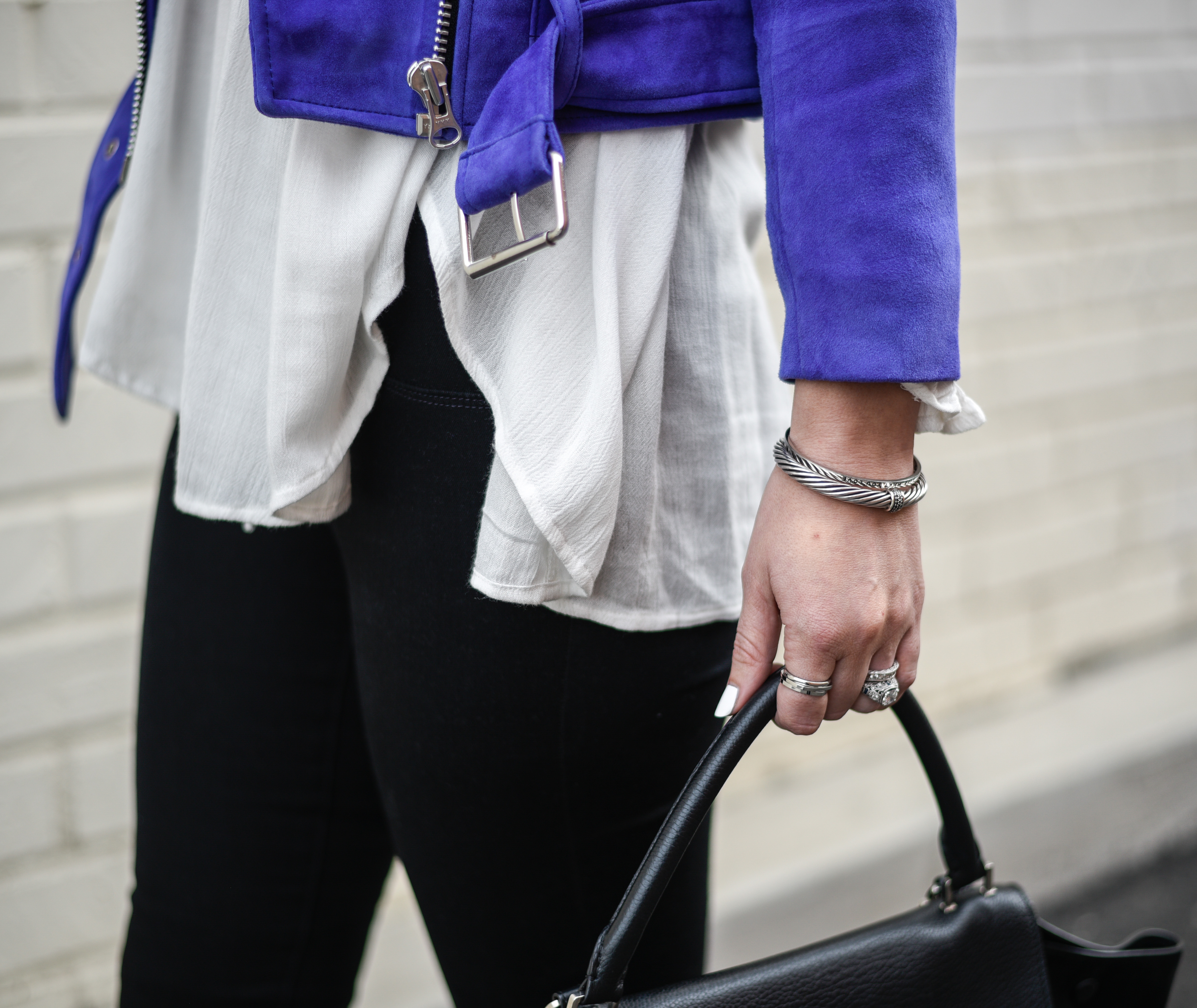 A bracelet stack in silver and black accents. 