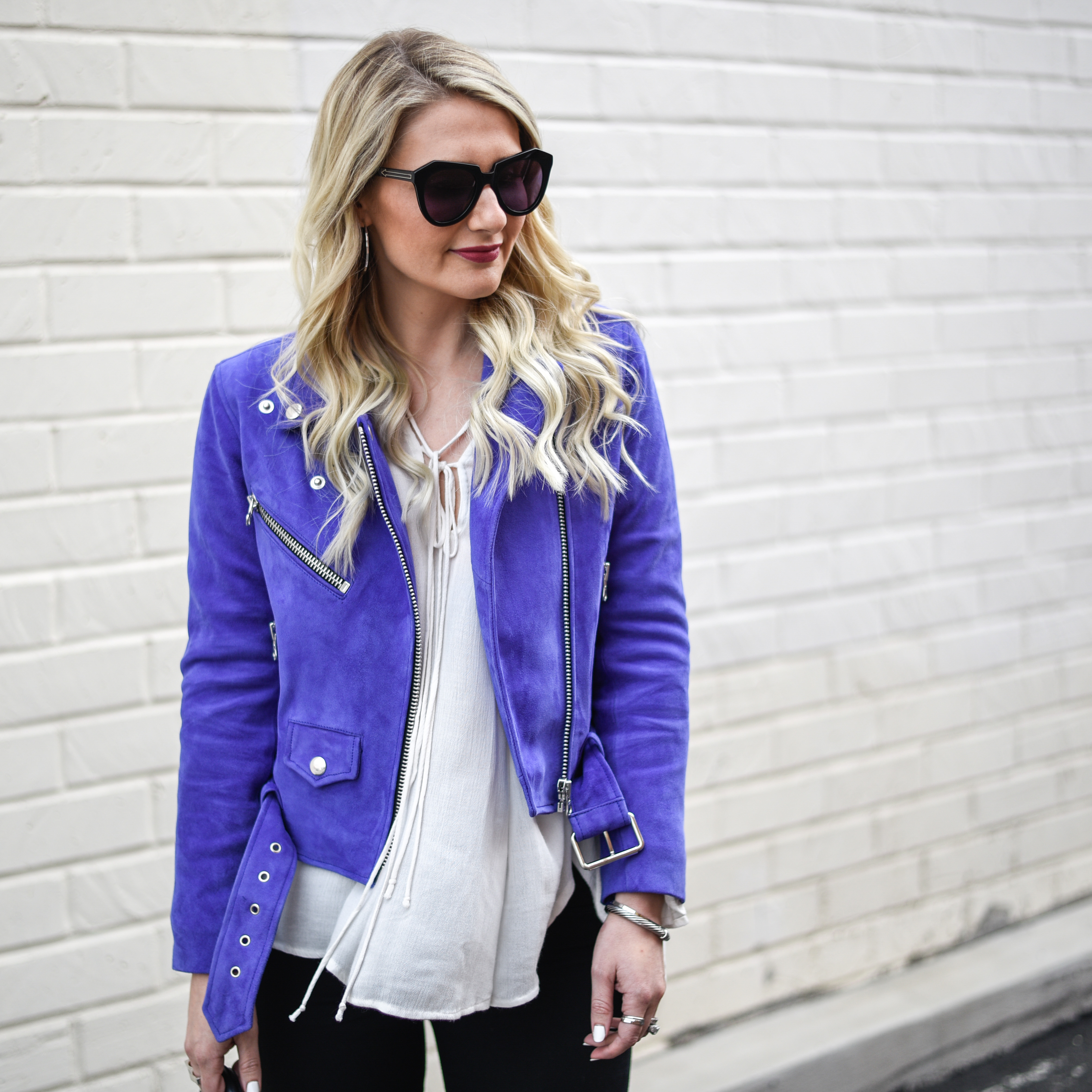 Making a statement with a purple modo jacket and edgy details. 