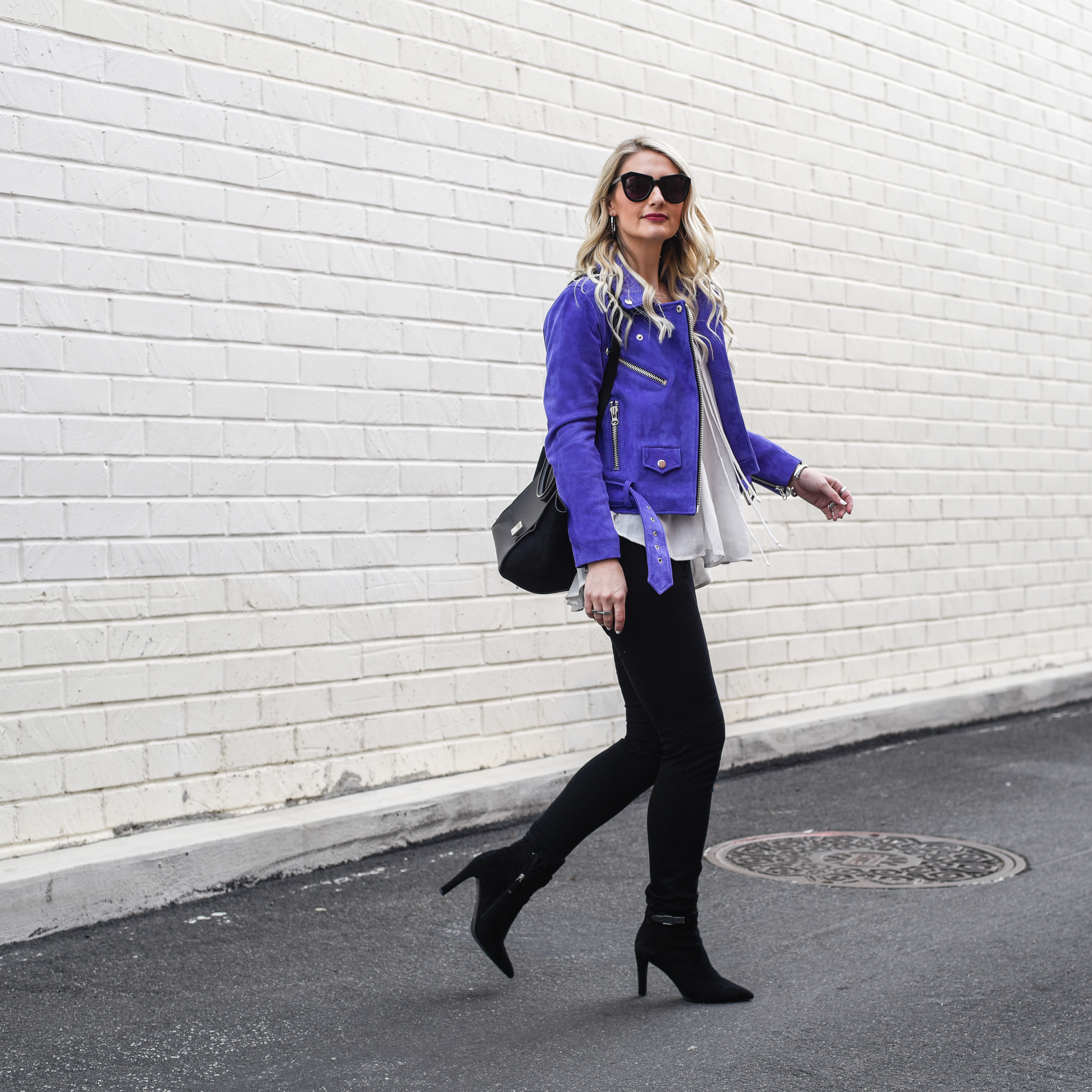 Walking around Santa Monica in weekend casual style with black and purple accents.