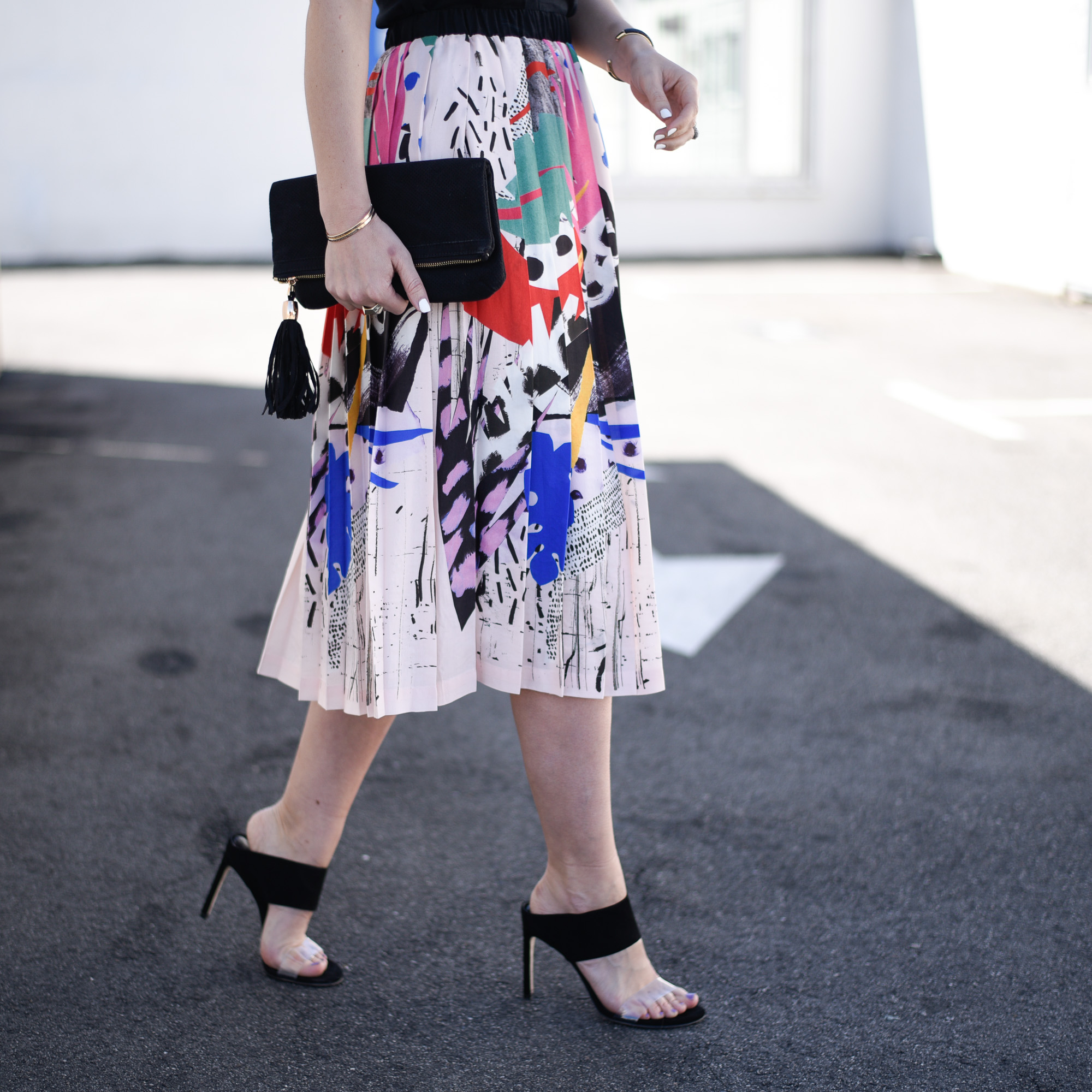 Pleated and painted colorful midi skirt perfect for spring at the office. 