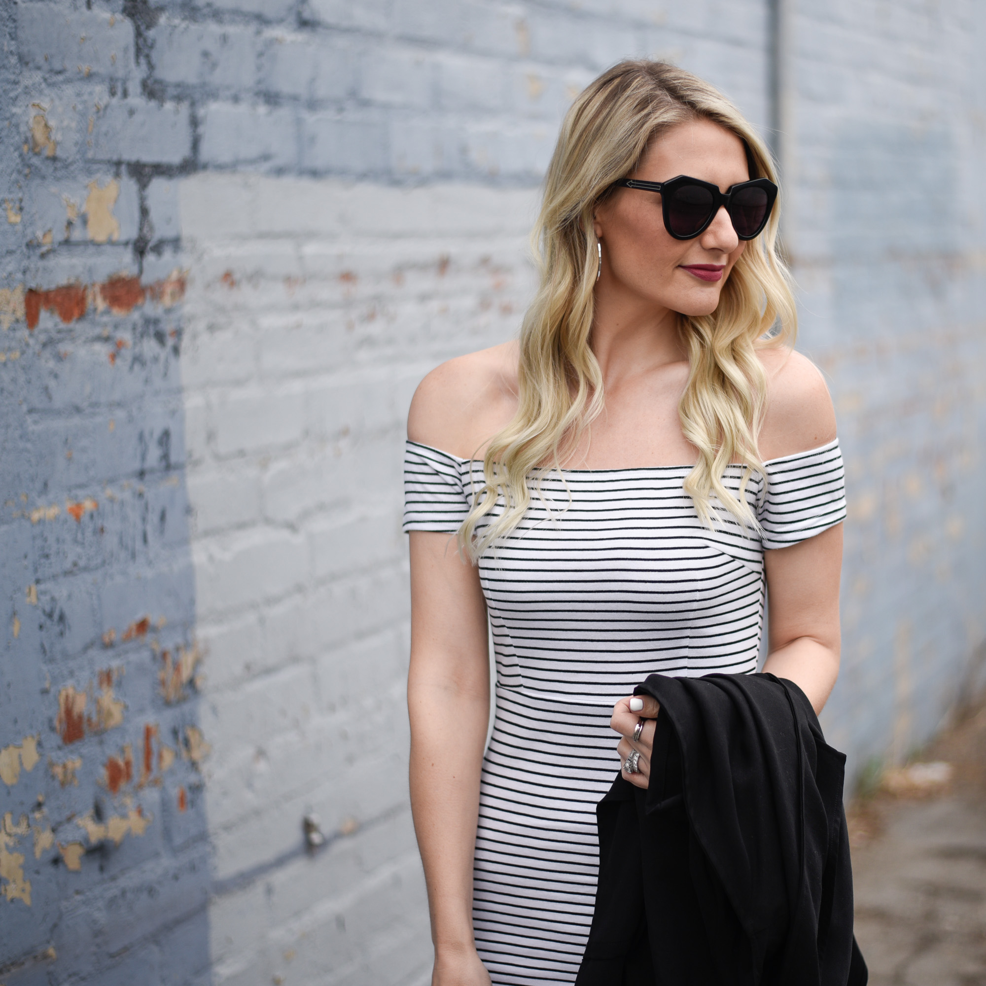 Off the shoulder bodycon dress in white and black stripes. 