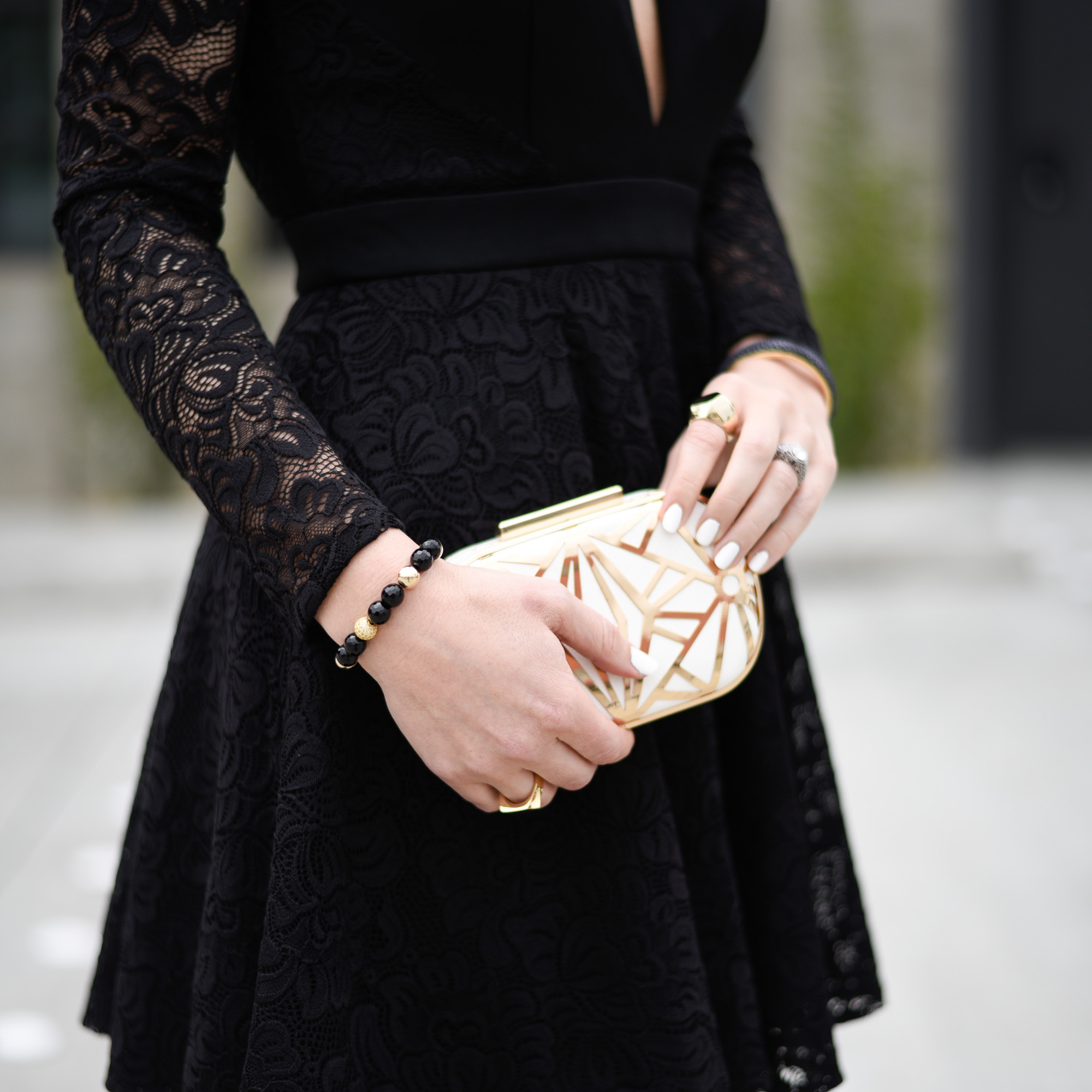 White and gold geometric clutch. 