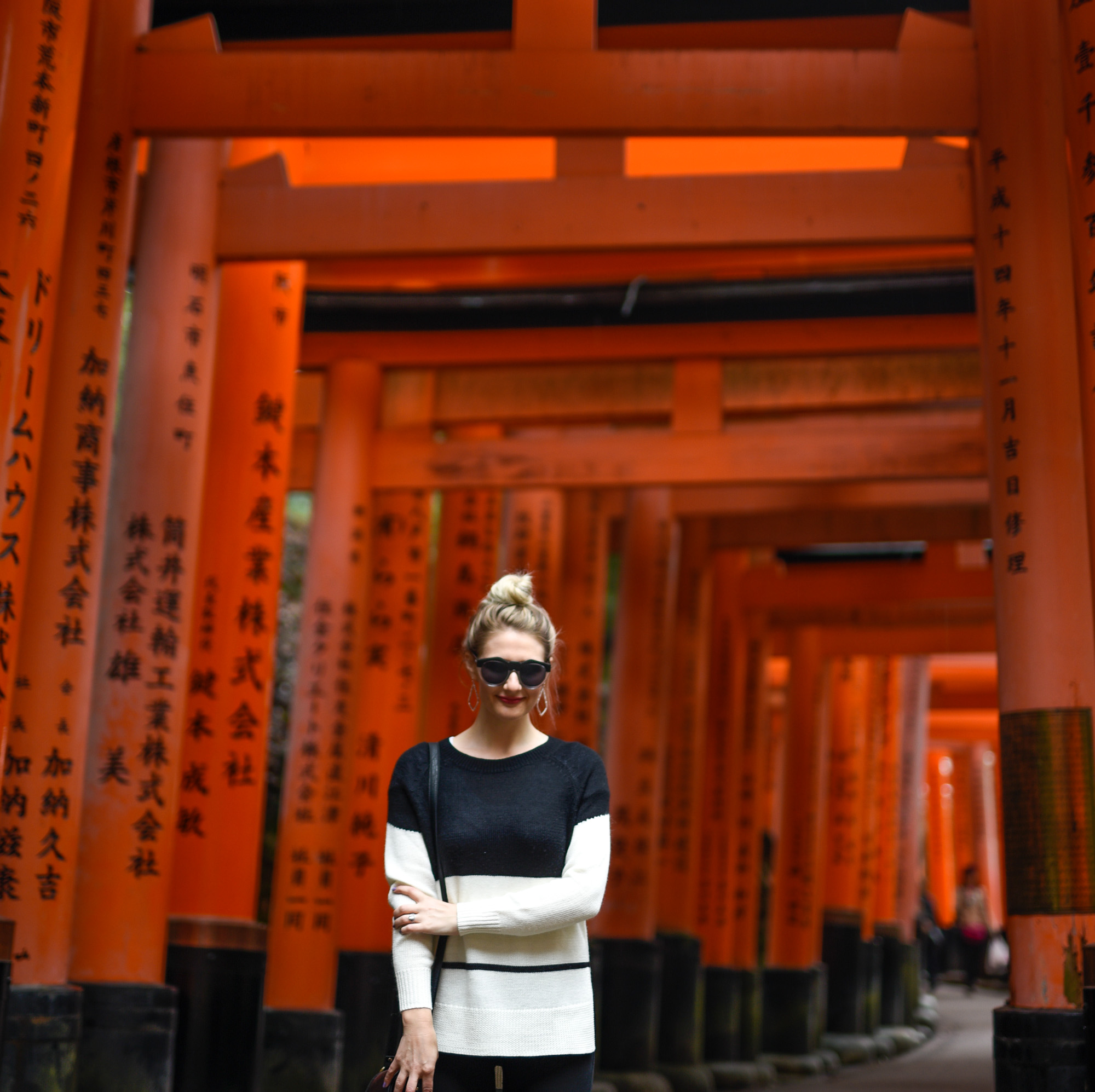 Sunset at the Fushimi Inari Temple in a colorblocked sweater.