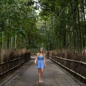 Looking up at the Arashiyama Bamboo Forest in a blue spring dress.