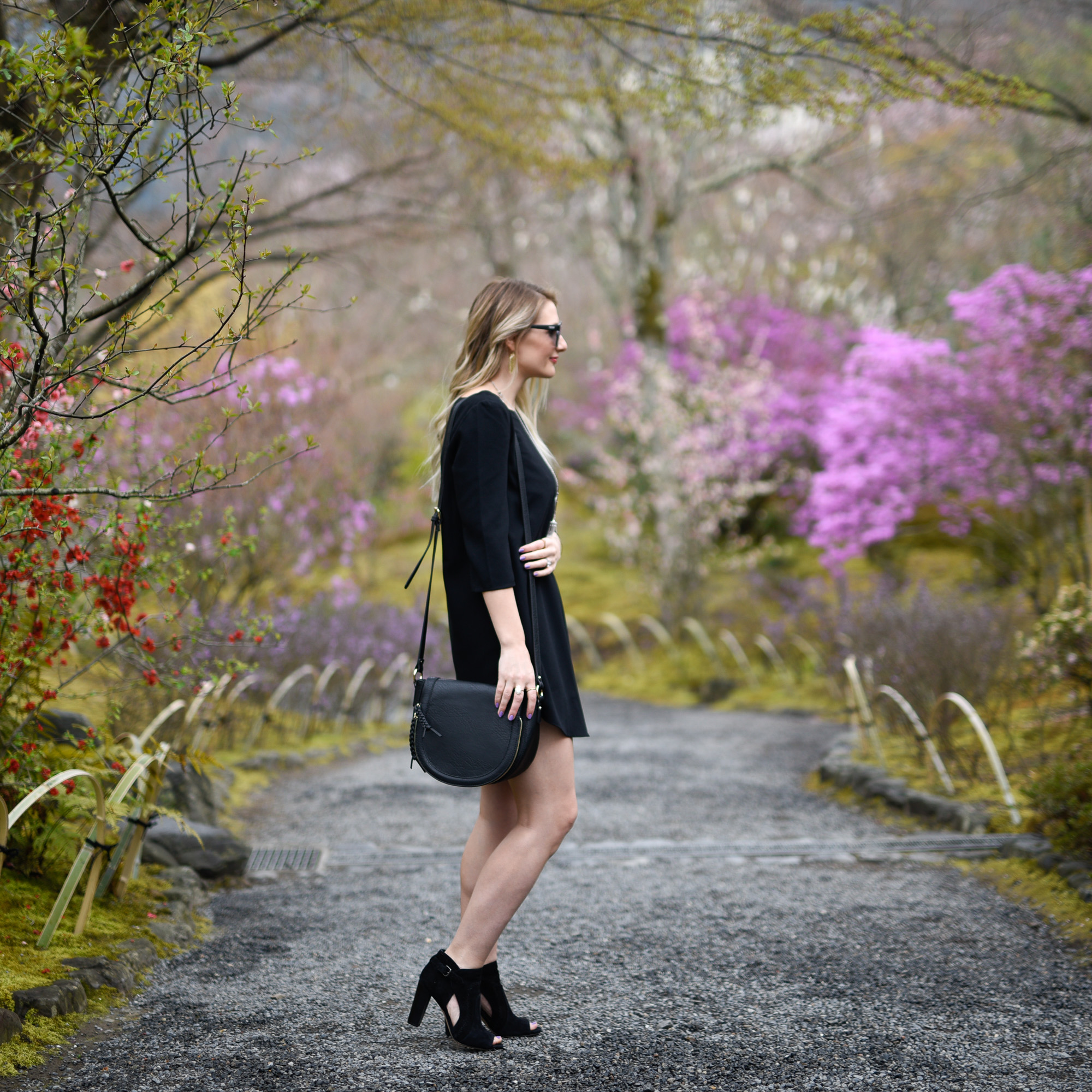 A black shift dress in the gardens at Tenryuji Temple. 