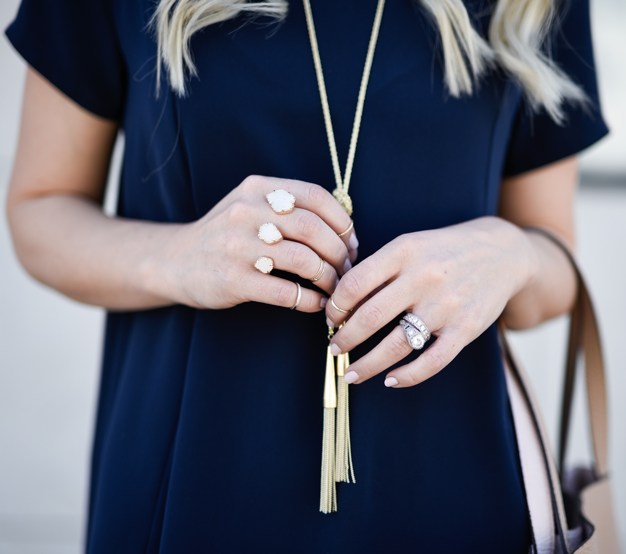 A gold tassel necklace that can easily be layered with other jewelry. 