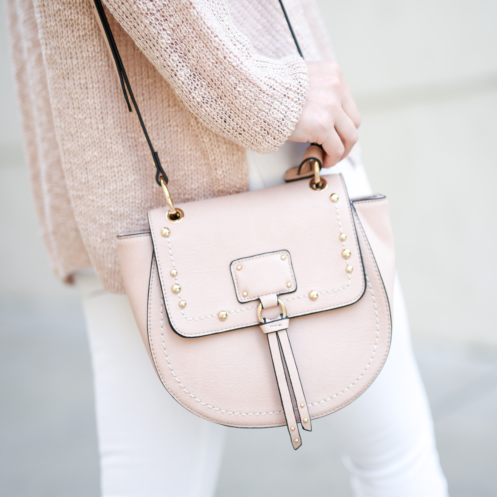 A pink saddle bag you will want to wear everywhere this spring.