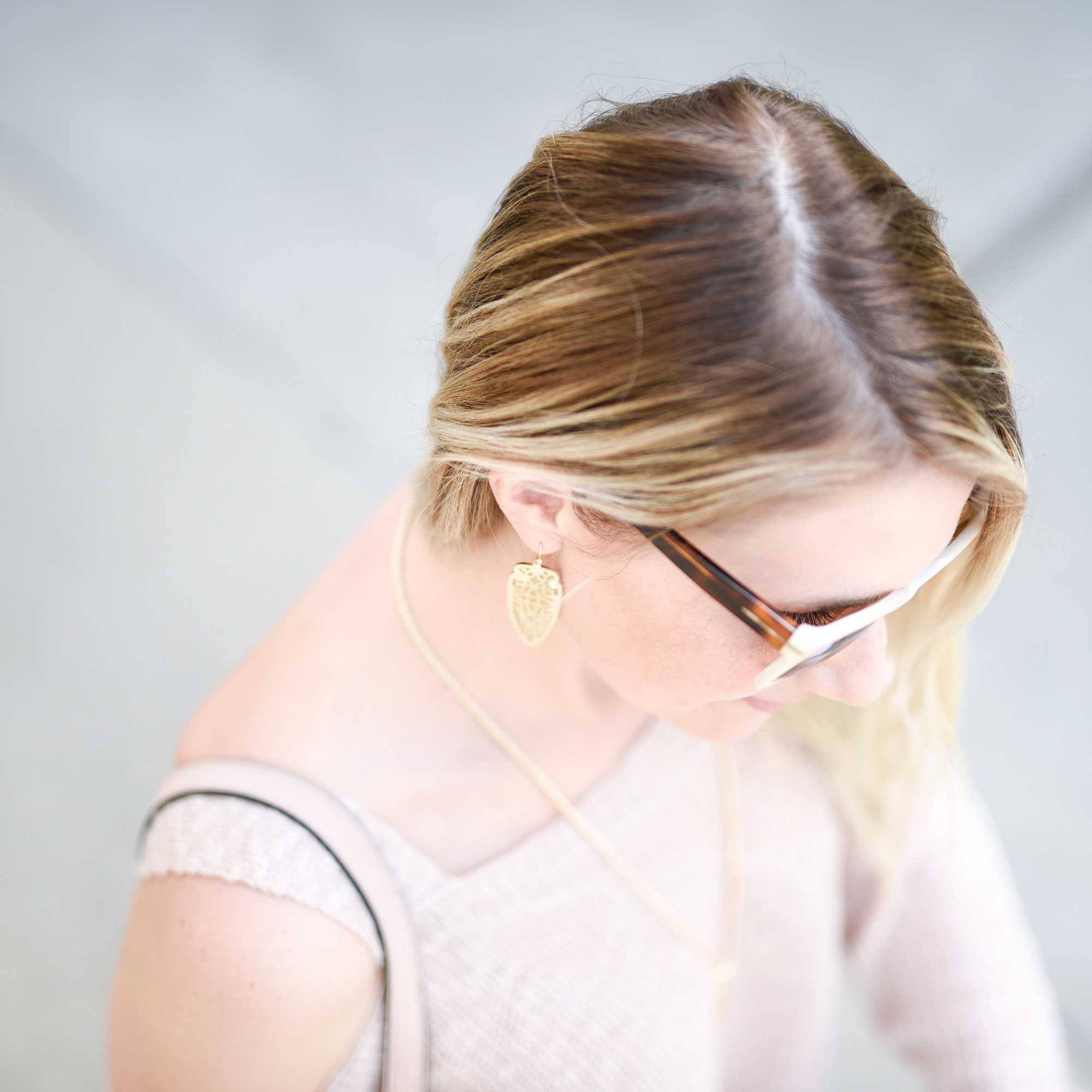 Golden statement earrings with a aztec texture. 