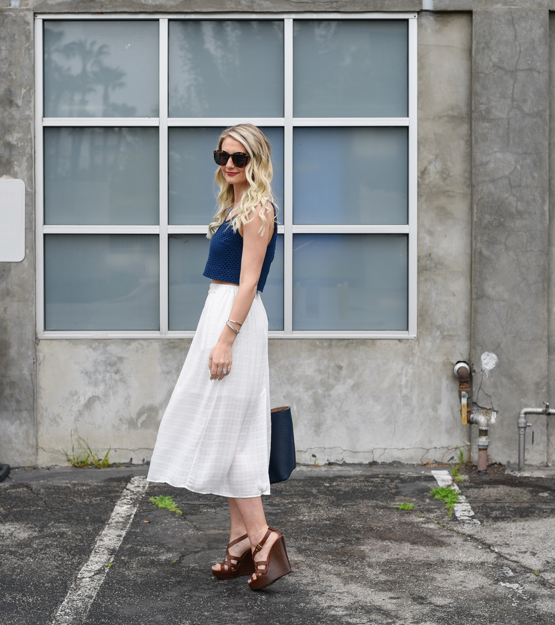 What to wear this summer: a midi skirt and a navy crop top.