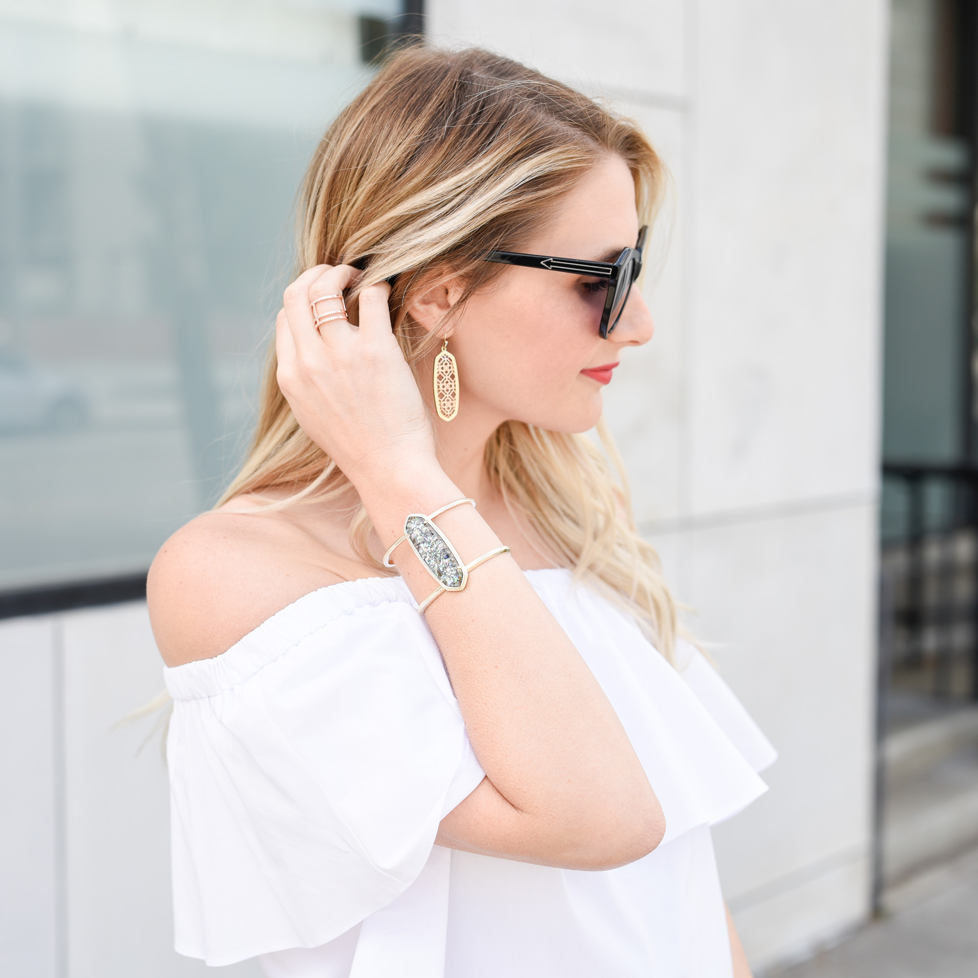 white off the shoulder top with a ruffle 