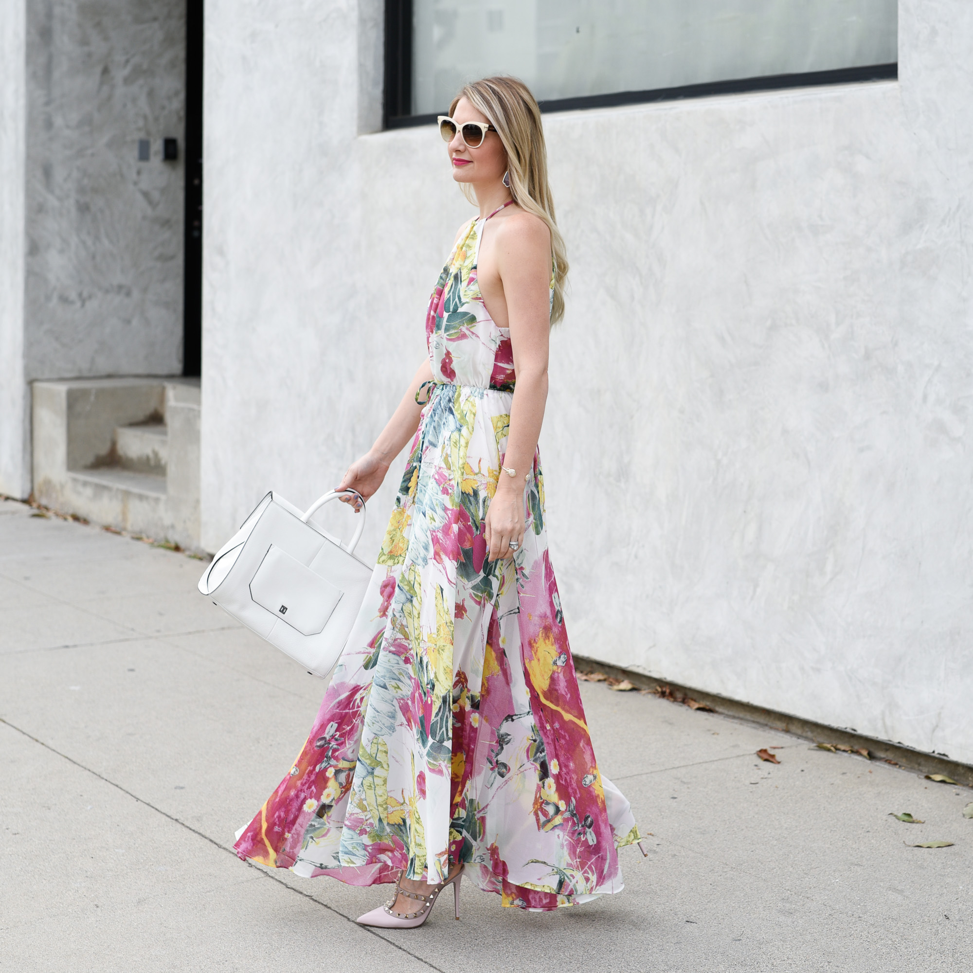 Twirling in an outfit that is the ideal wedding guest outfit