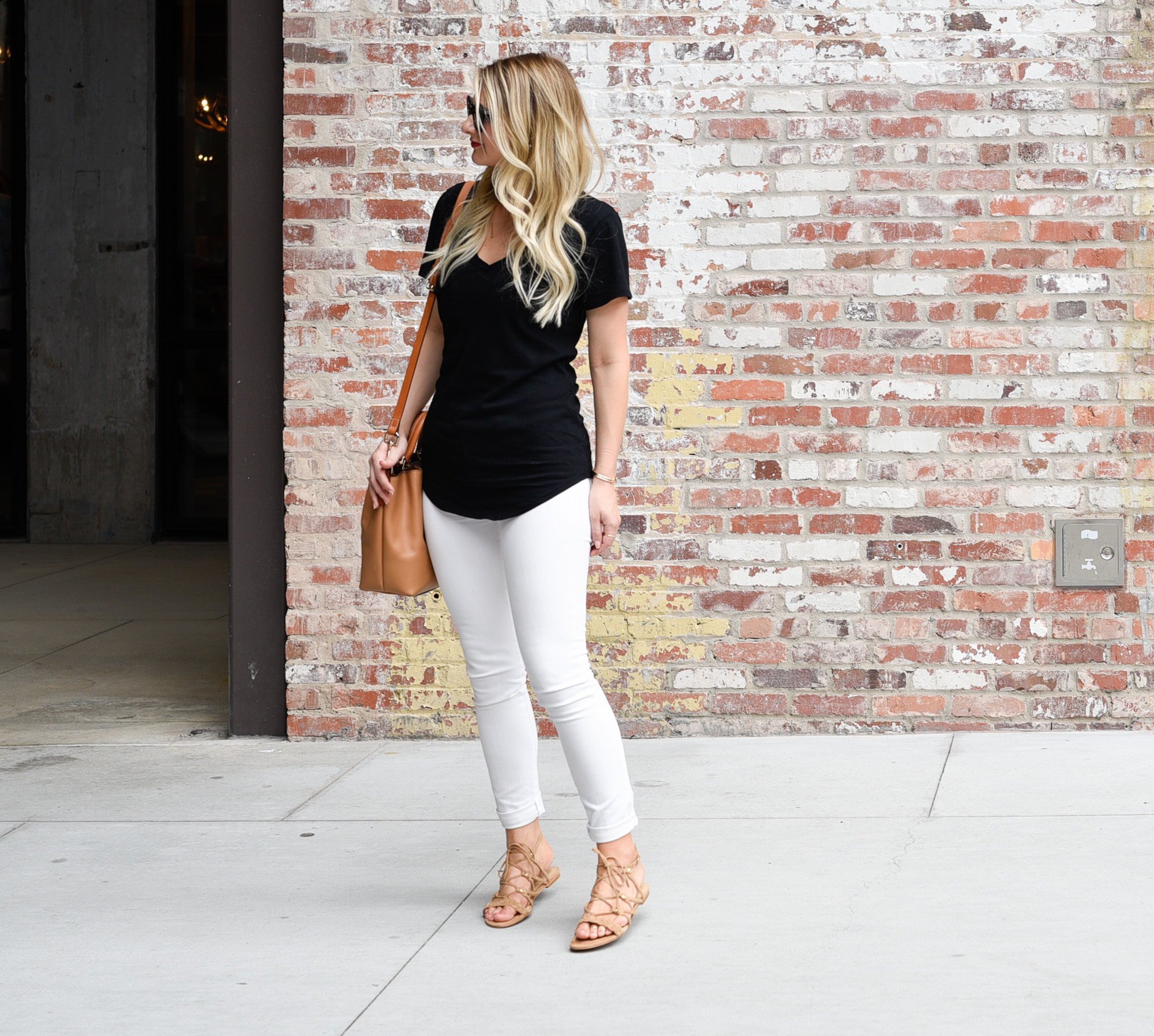 Black v neck tee and white skinny jeans. 