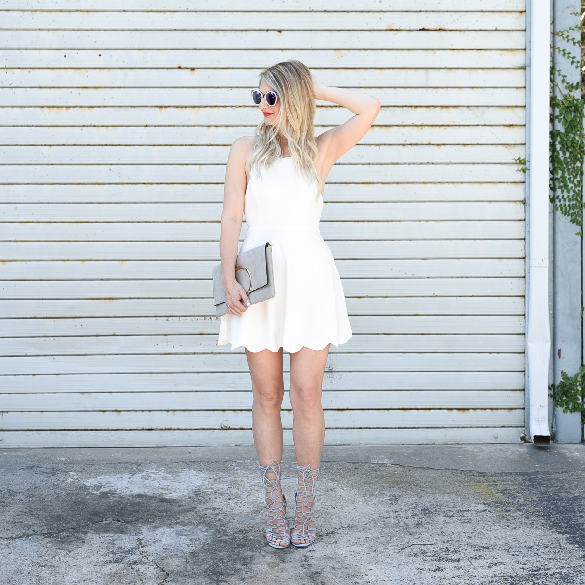 Little white dress with scalloped hem. 