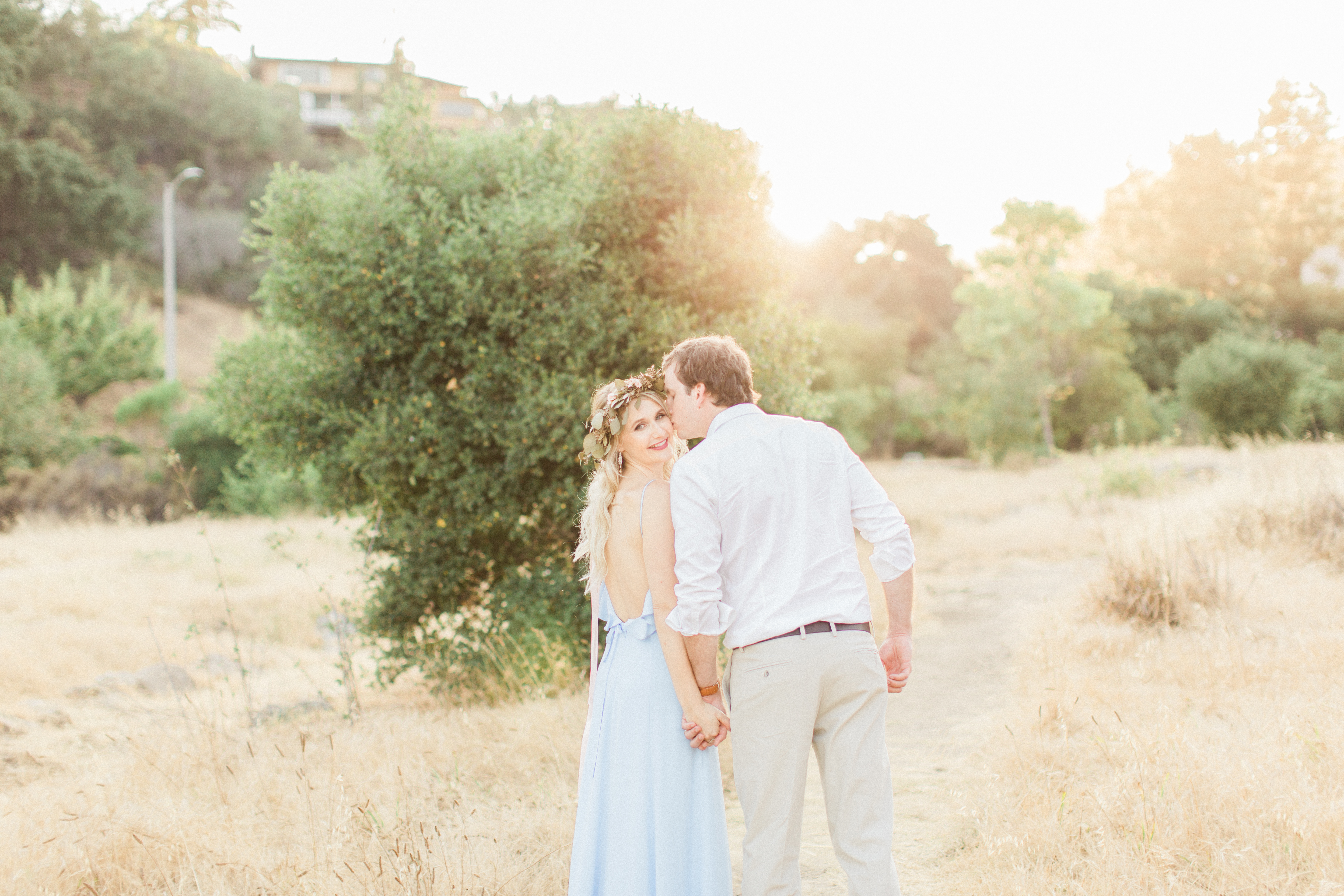 Blue ruffled maxi dress and groom in khakis. 