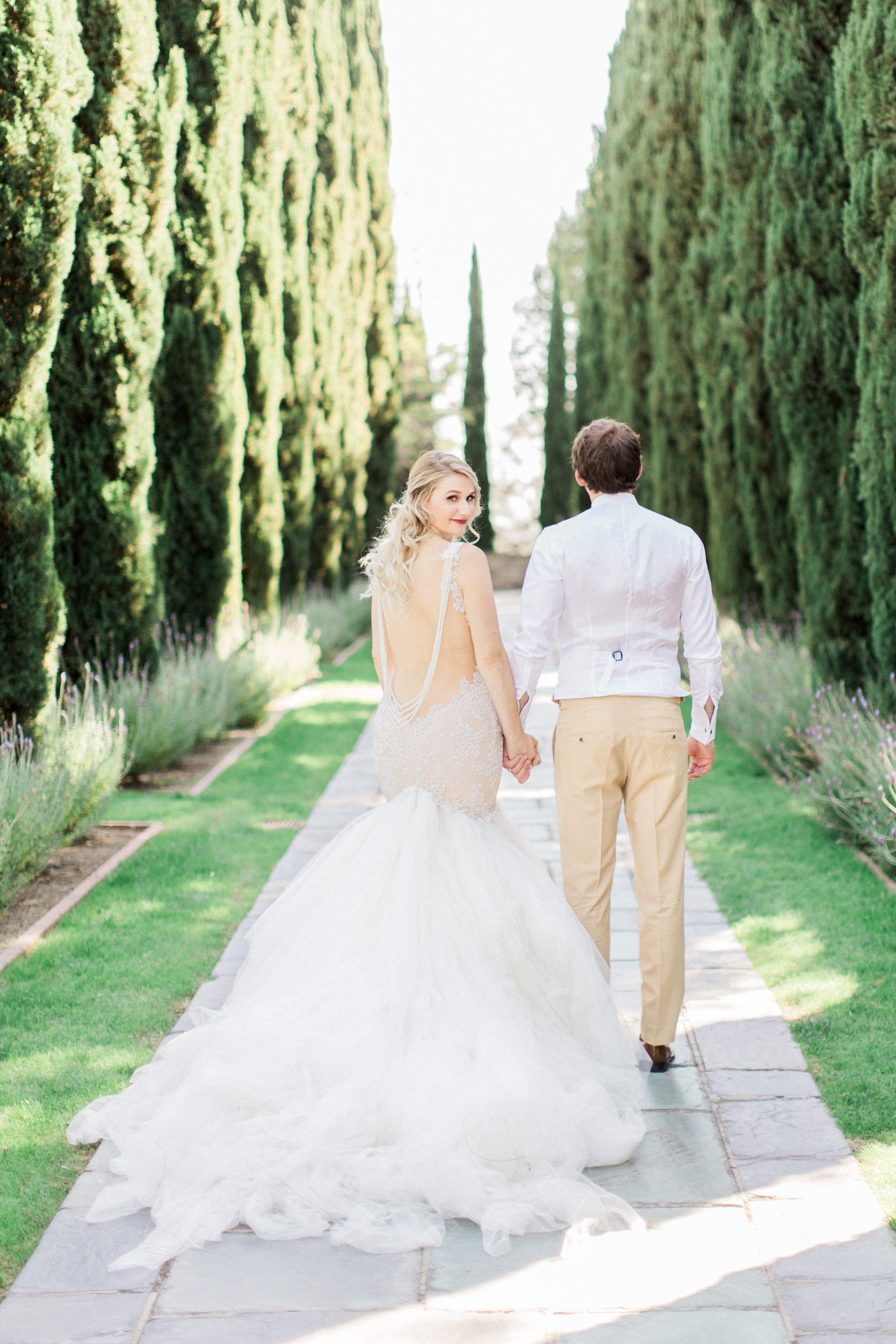 Low back wedding dress with strings of pearls. 