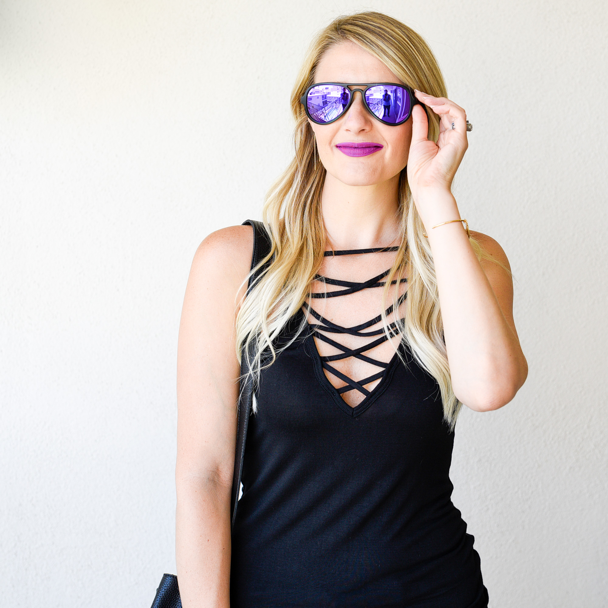 Purple mirrored Aviator sunglasses.