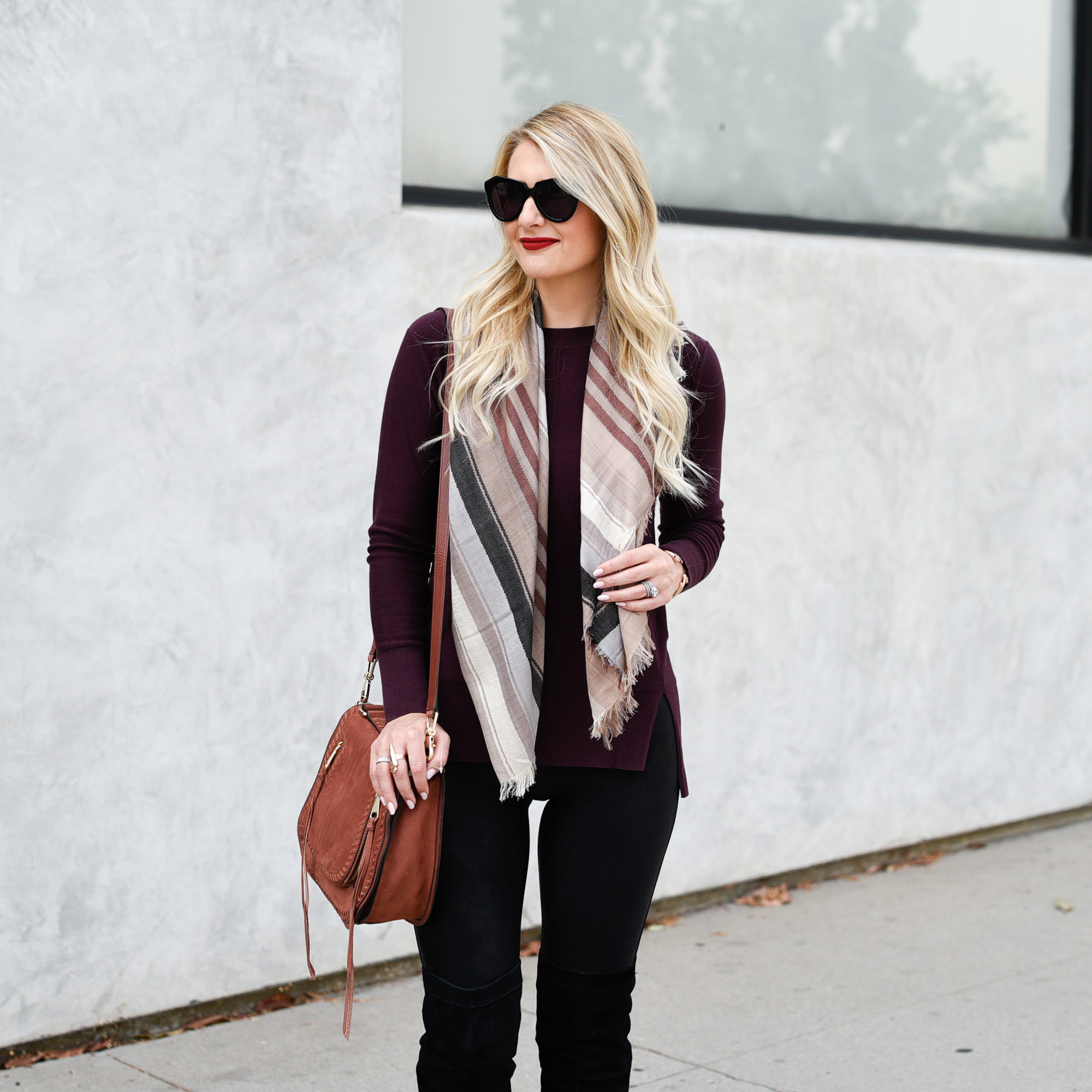 Burgundy oxblood tunic with a plaid scarf. 