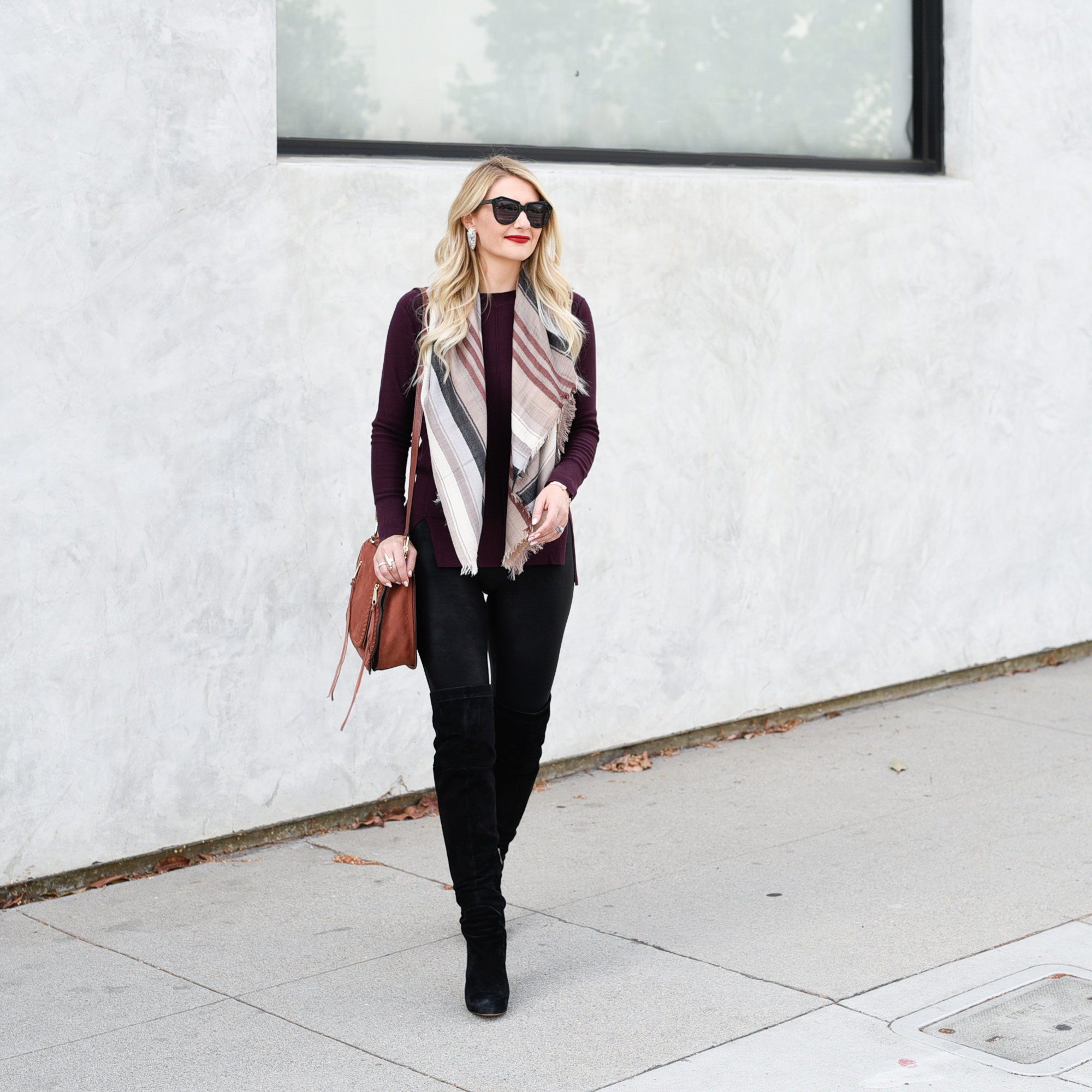 Oxblood sweater and black faux leather leggings. 