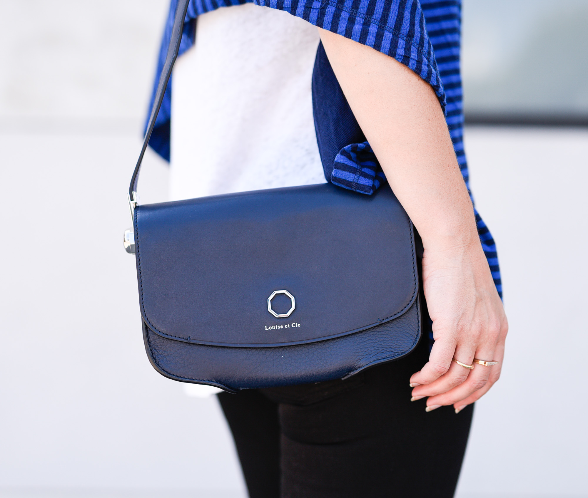 Love the structure of this navy blue crossbody bag! 