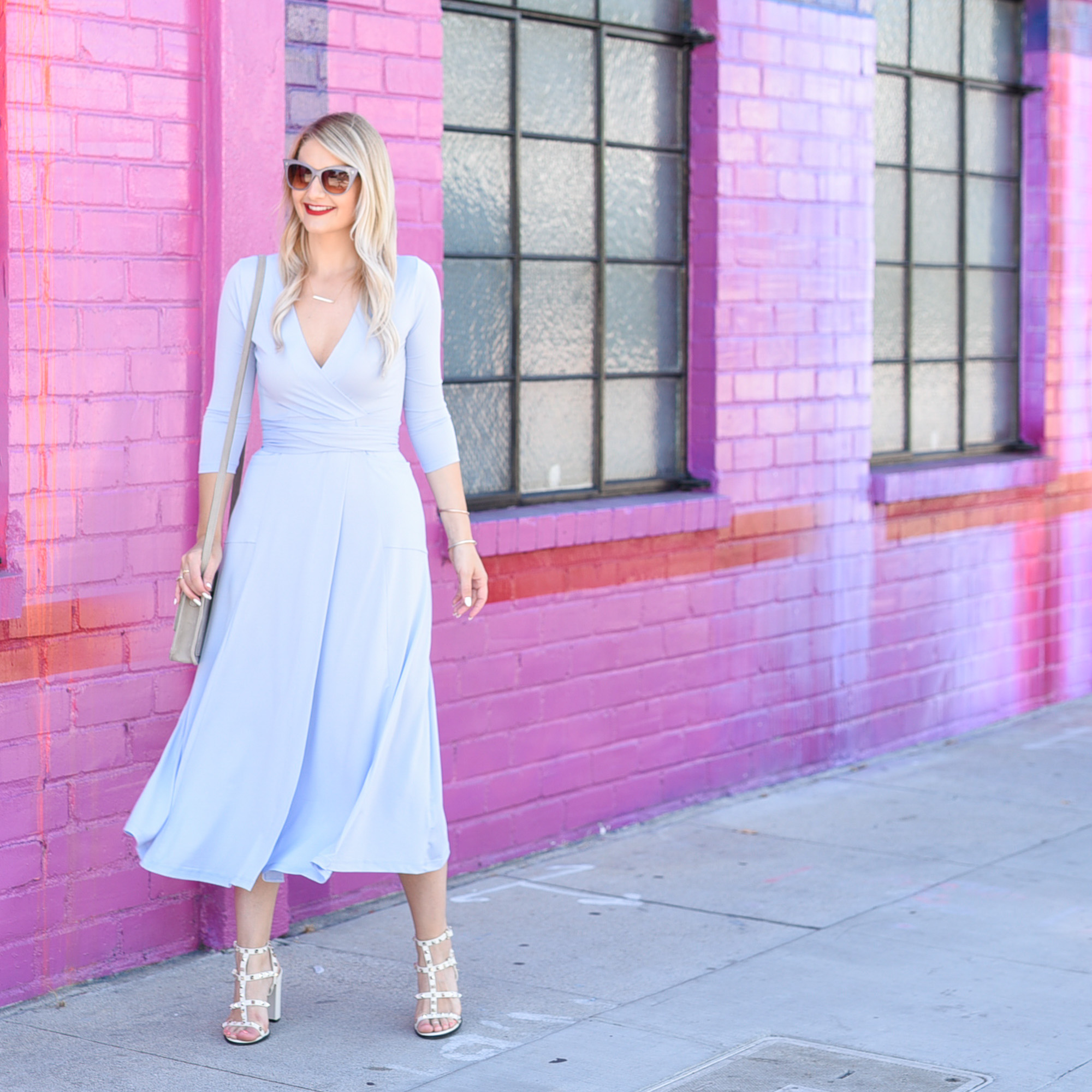Jenna Colgrove in a pastel blue wrap midi dress by ASOS. 