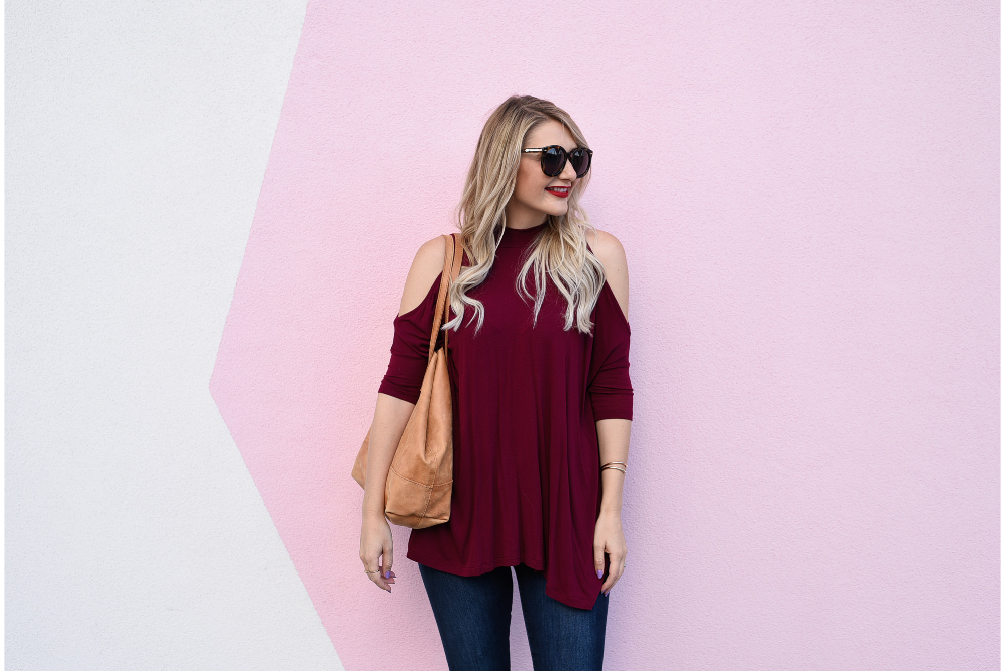 Jenna Colgrove wearing an ASOS cold shoulder tunic in burgundy. 