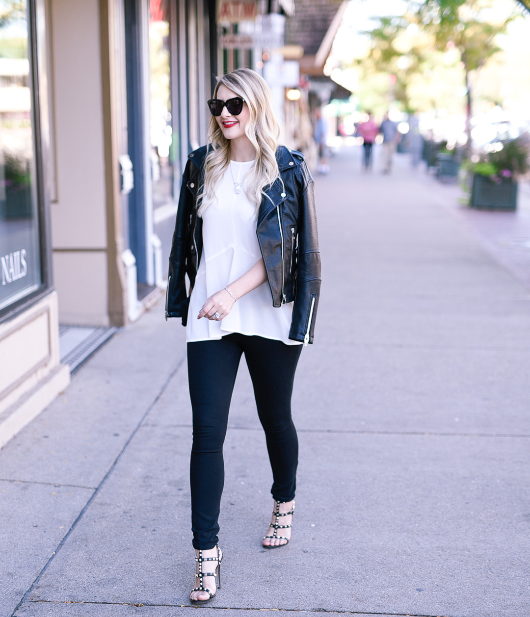 Jenna Colgrove wearing black skinny jeans by Paige Denim and Valentino Rockstud heels. 