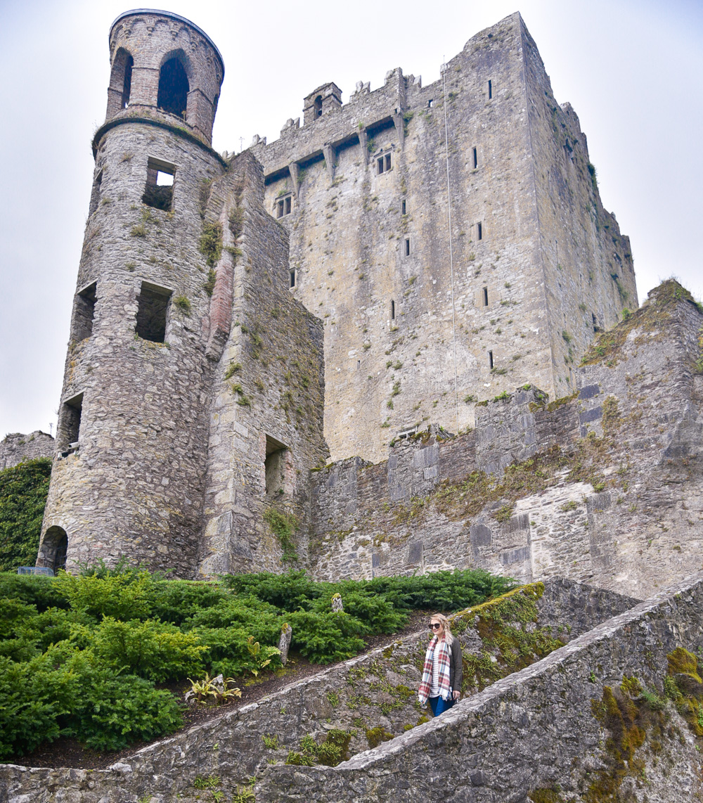 Jenna Colgrove in a Nordstrom plaid blanket scarf at Blarney Castle in Cork, Ireland. 