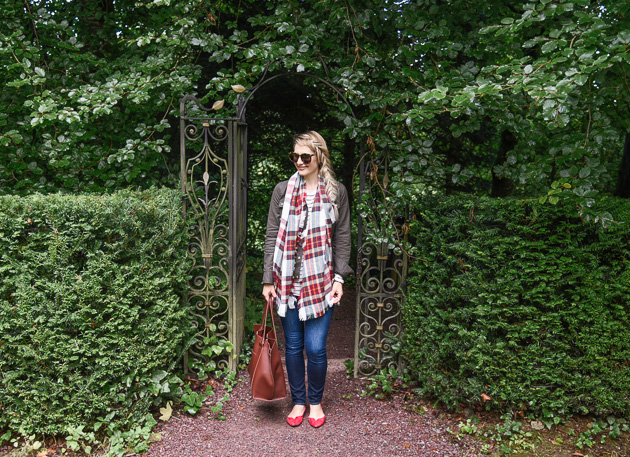 Jenna Colgrove wearing the J.Crew Downtown Field Jacket and Paige Denim jeans at Blarney Castle. 