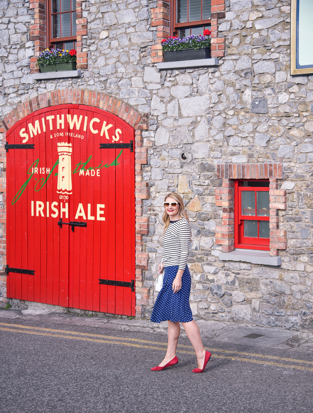 Red door in Kilkenny and Jenna Colgrove in a navy striped sweater and red suede flats! 