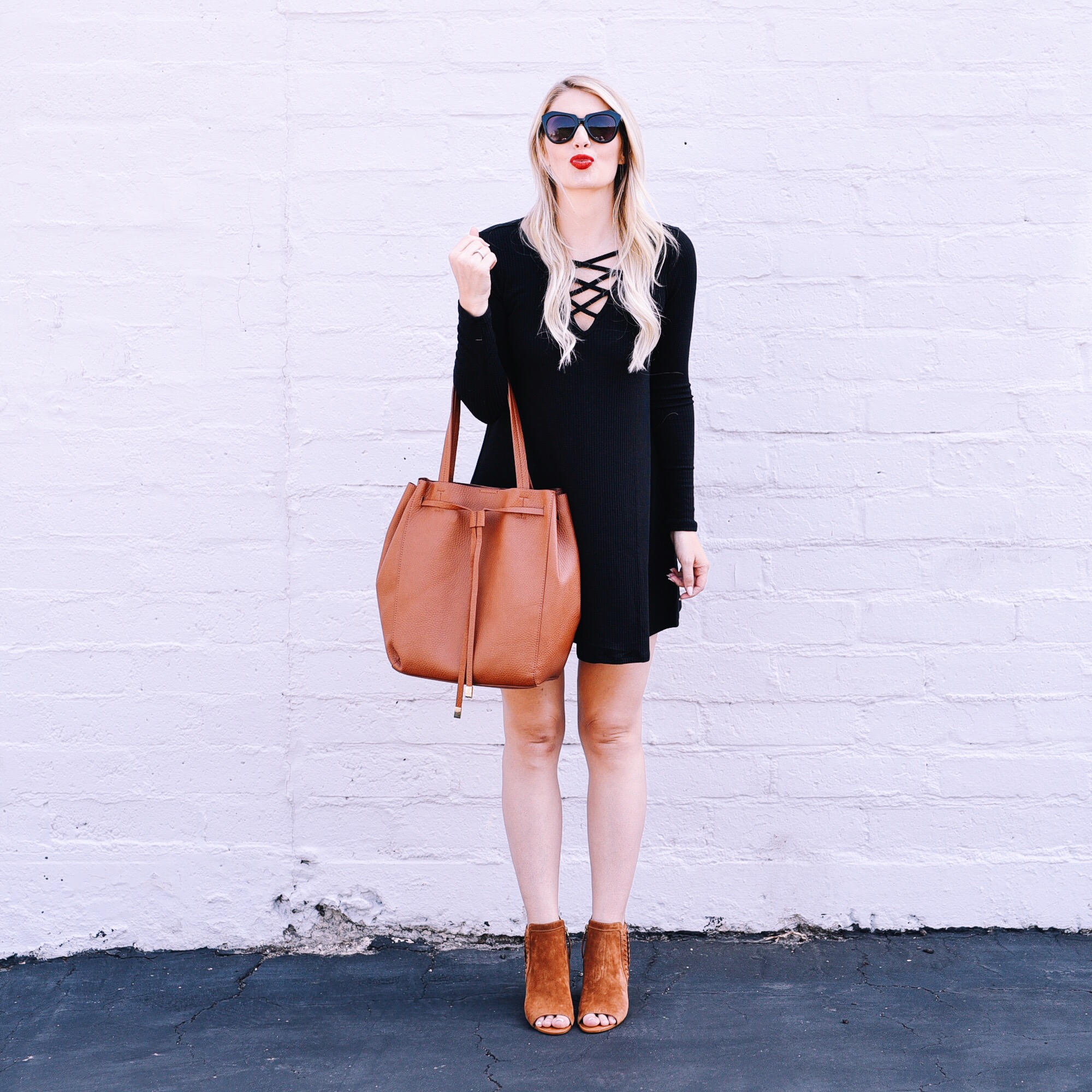 Jenna Colgrove in an ASTR Black lace up Dress and SARTO Sylvania peep toe boots. 