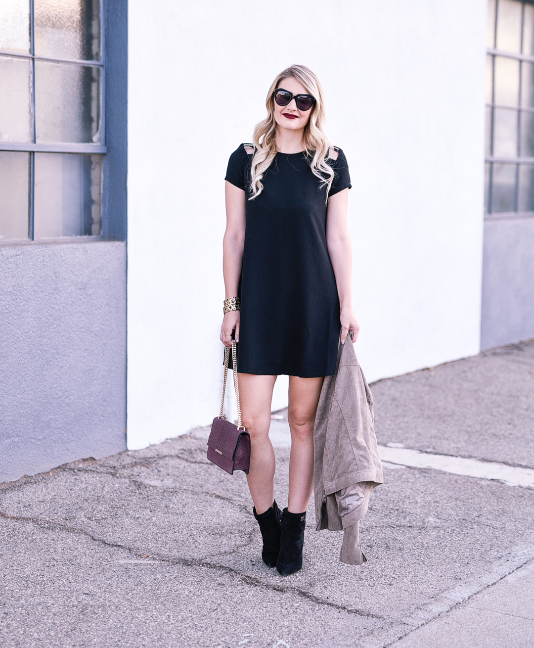 Jenna Colgrove wearing a Speechless Shoulder Cut Out Shift Dress in black.