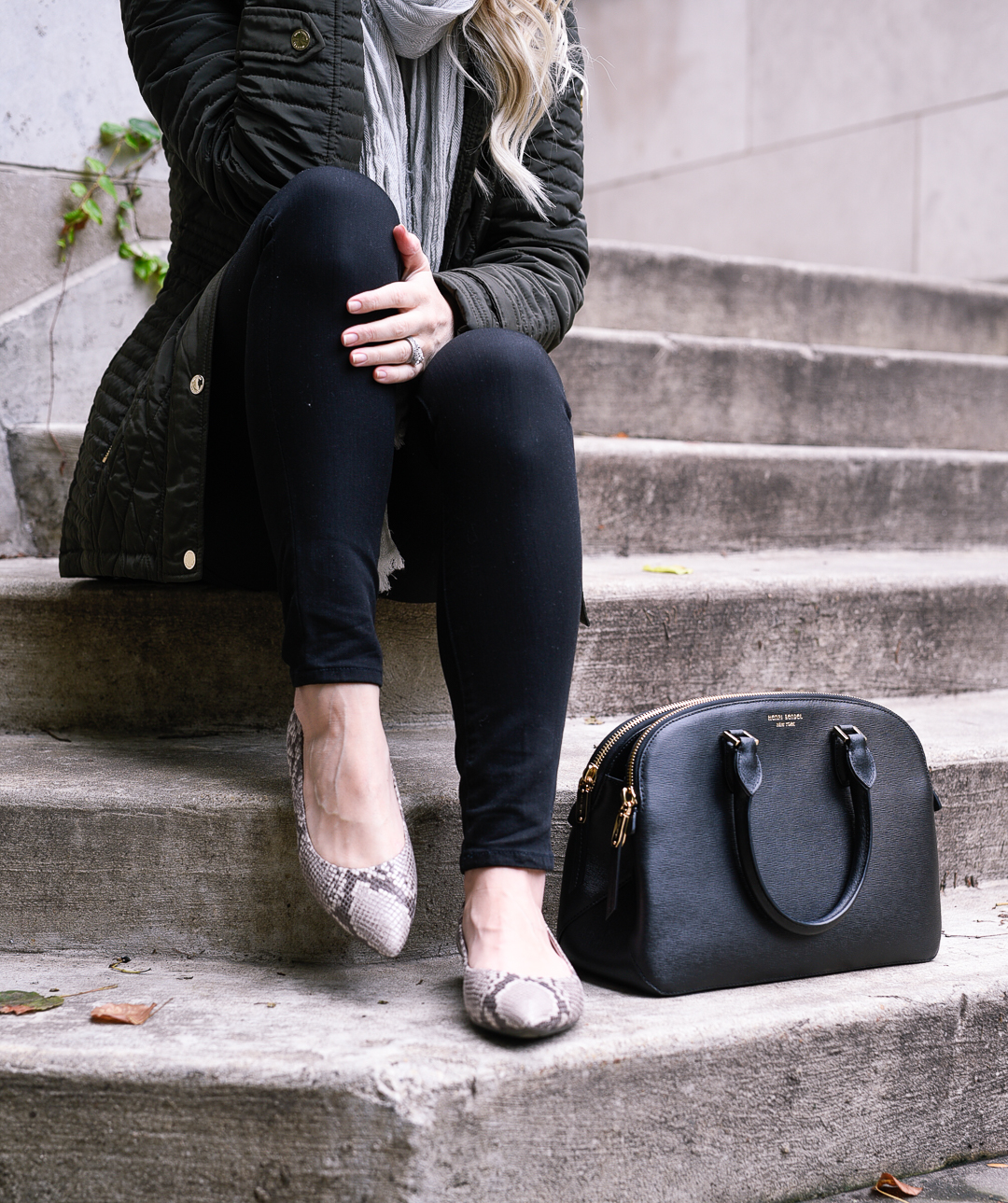 Jenna Colgrove wearing Rockport Adelyn Snakeprint Flats and black skinny jeans. 