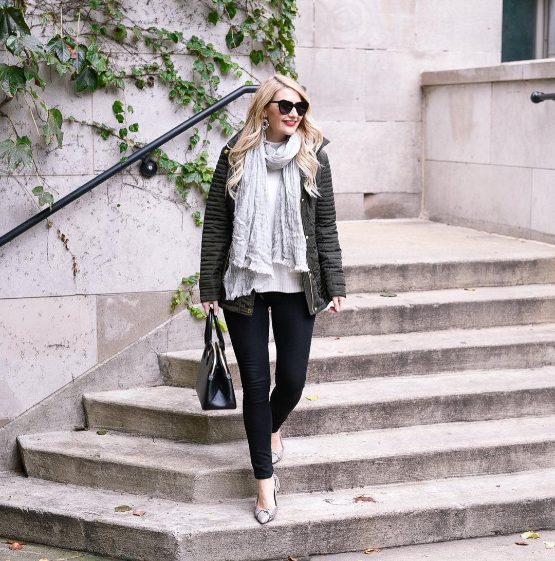 Jenna Colgrove's fall outfit: green puffer jacket, black skinnies, snake skin flats, and a black bag. 