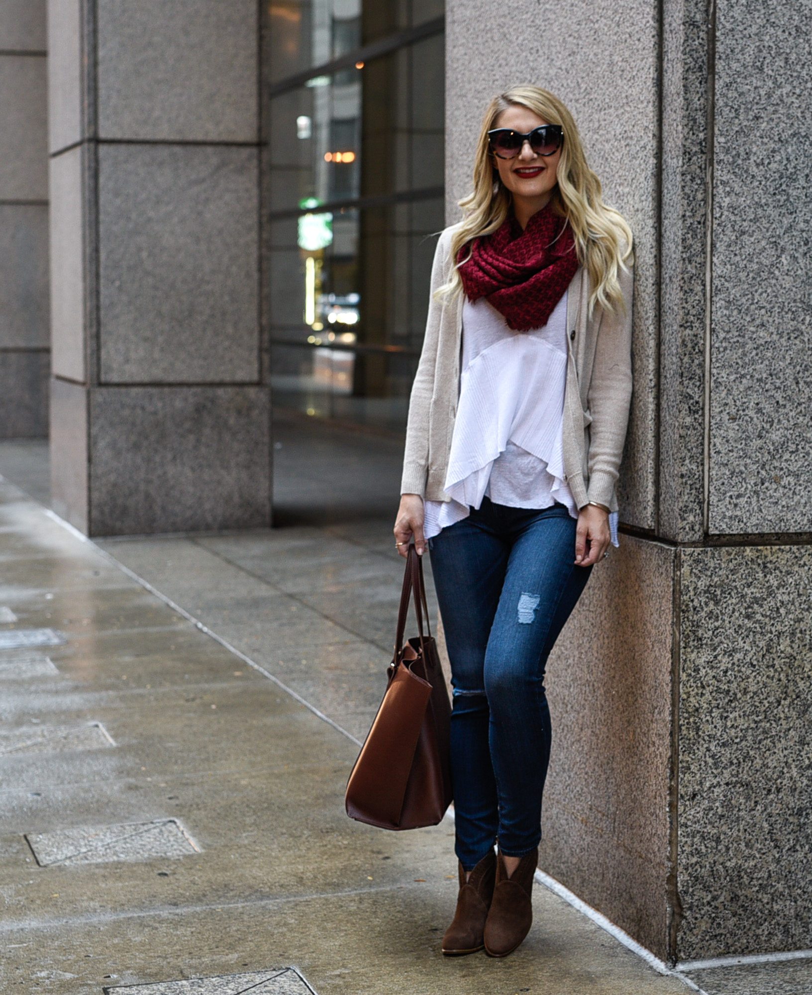 Jenna Colgrove wearing distressed skinnies, brown suede booties, and a red infinity scarf. 