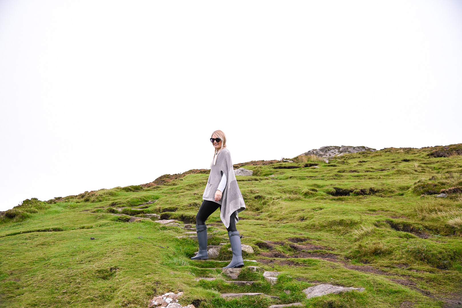 Jenna Colgrove in an Anthropologie Madison Park Poncho at Slieve League, Ireland