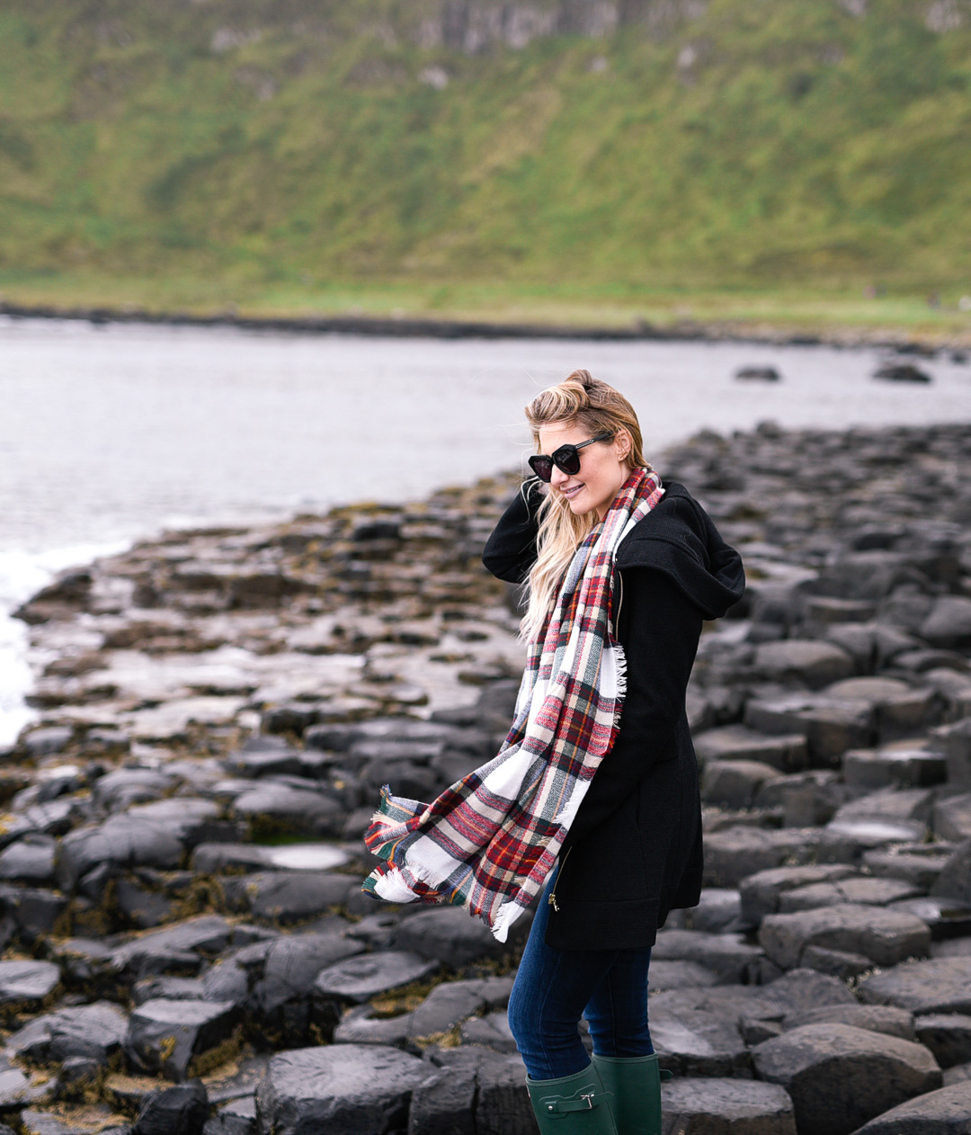 Jenna Colgrove wearing the Guess Mod Hoodie Coat at Giant's Causeway. 