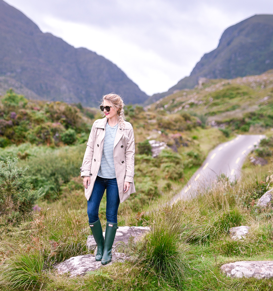 Jenna Colgrove wearing a beige London Fog double breasted trench coat in Ireland. 