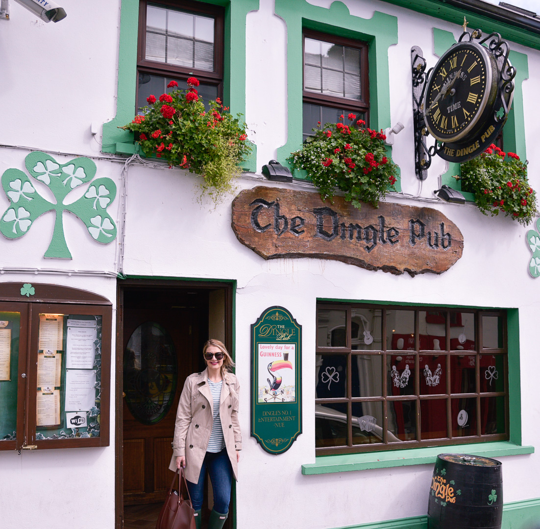 Jenna Colgrove stopping for a pint of Guinness in Dingle, Ireland wearing a London Fog quilted trench coat. 