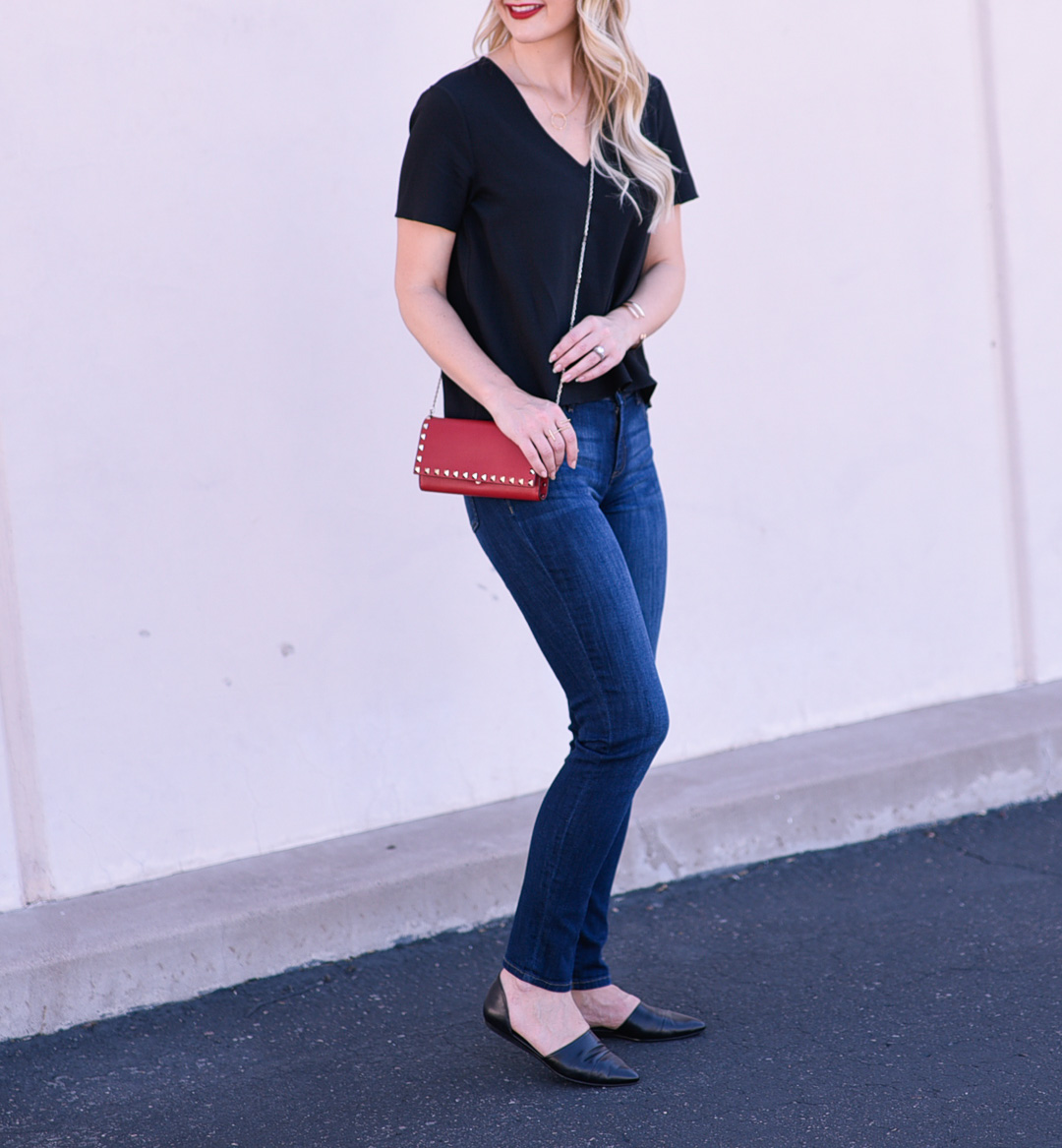 Jenna Colgrove wearing black leather flats and dark wash DL1961 skinny jeans.