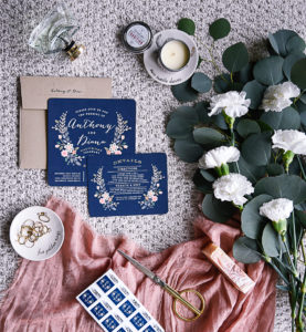 Pretty bohemian themed wedding invitations in navy and pink.