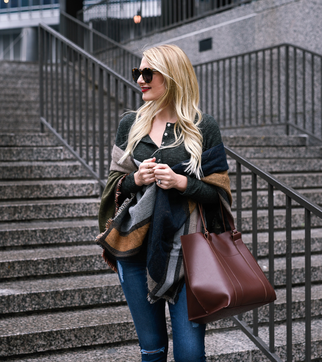 Jenna Colgrove wearing the Sole Society Ravin tote in dark brown, a geometric printed scarf, and a hunter green henley.
