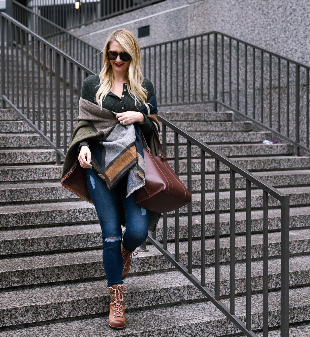 Jenna Colgrove wearing a Nordstrom geo scarf, ripped jeans, and SOREL wedges. 