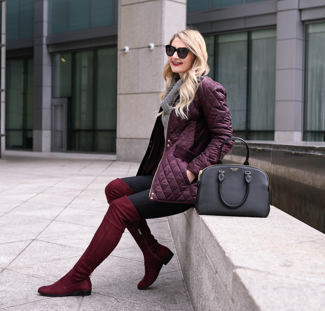 Burgundy suede otk boots and a quilted purple jacket. 